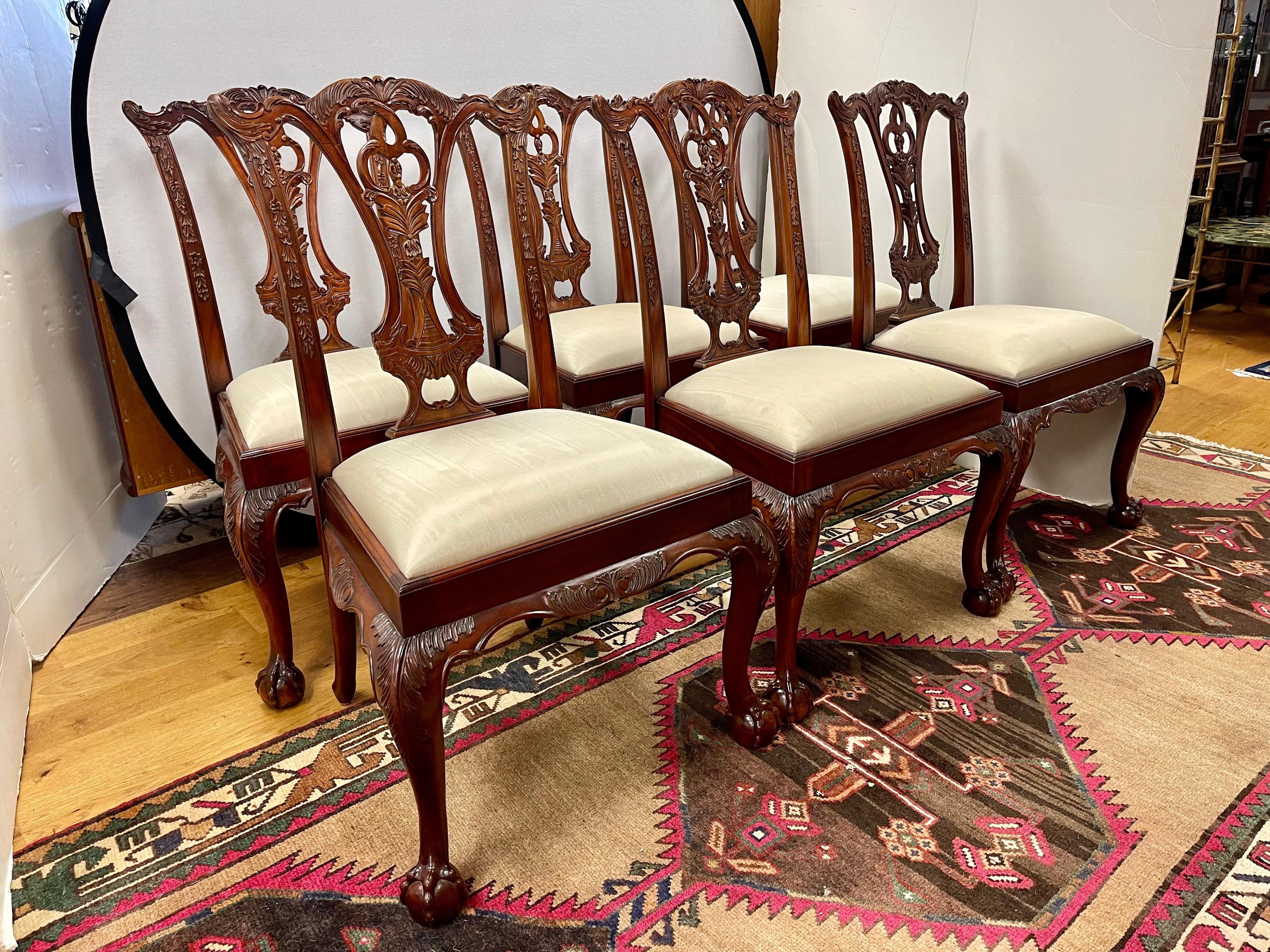 Set of six Maitland Smith mahogany Chippendale style dining chairs. Listing includes (6) side chairs with neutral silk upholstered seats, solid wood construction, beautiful wood grain, finely carved details, quality craftsmanship, great style and