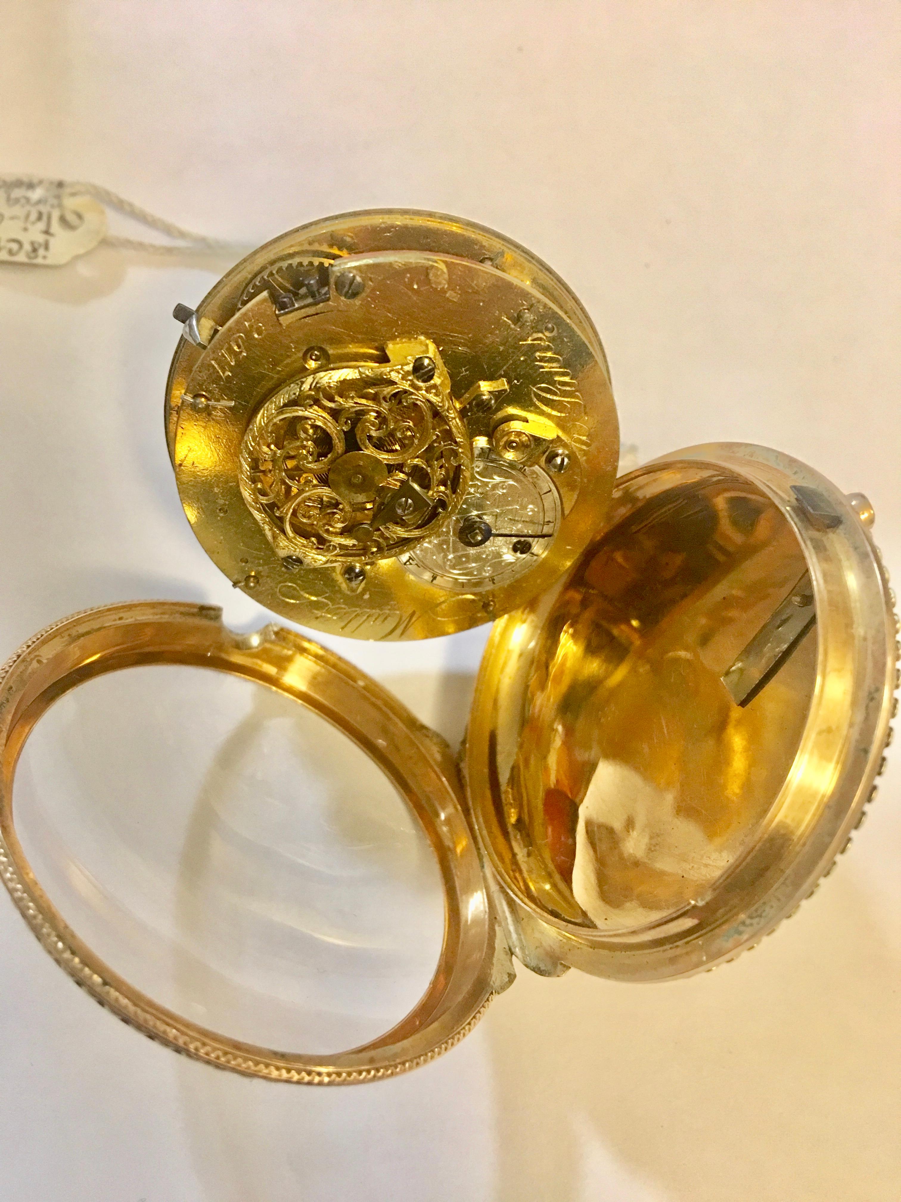 A beautiful finely made tri-color 18-karat gold by Mallet A Paris. The ornately designed case features a man, woman and a cherub inset as the focal point, surrounded by intricate and detailed foliage and floral design. All decorated in rose gold,