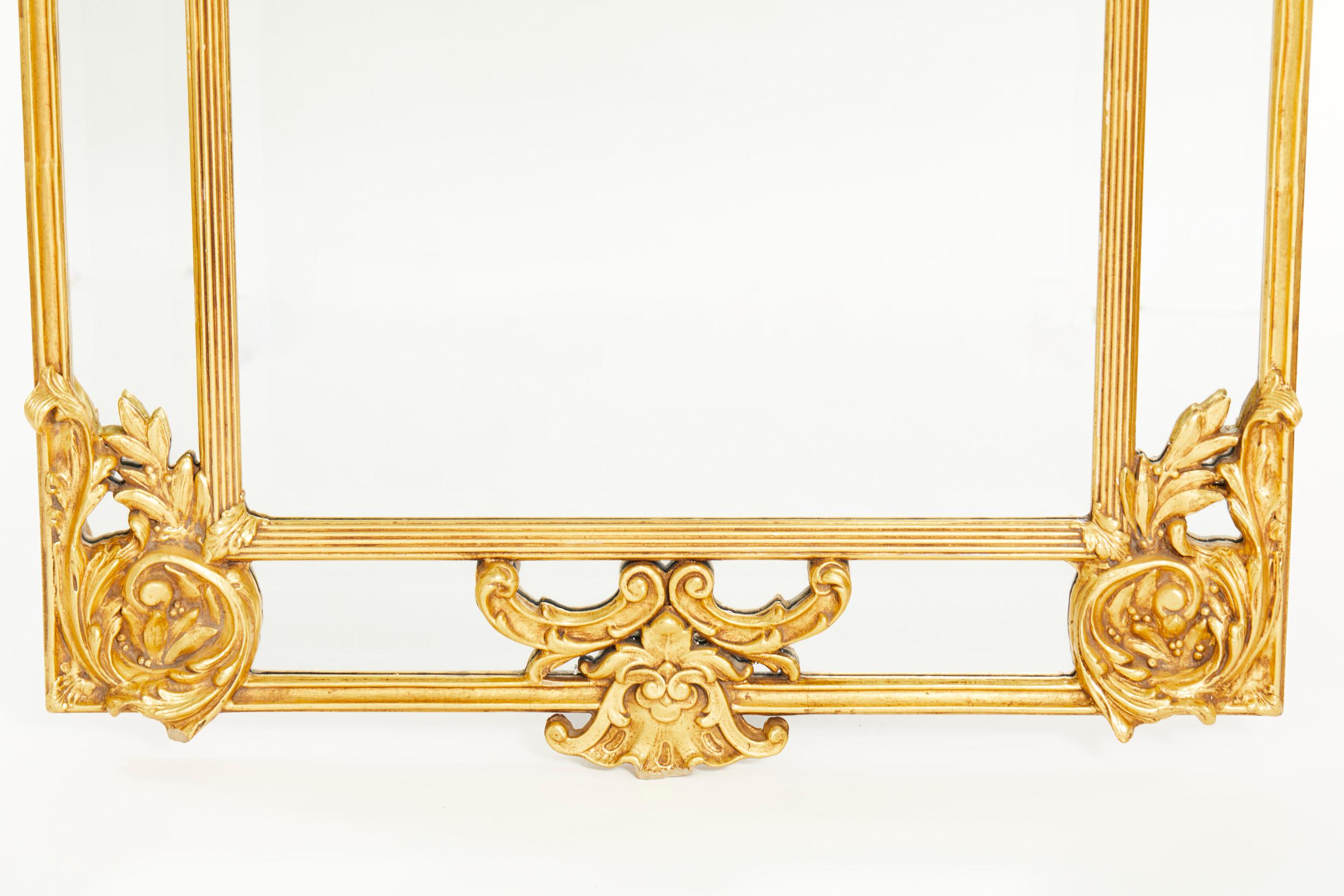 Hollywood Regency Ornately Gilt Wood Framed Hanging Wall Mirror For Sale