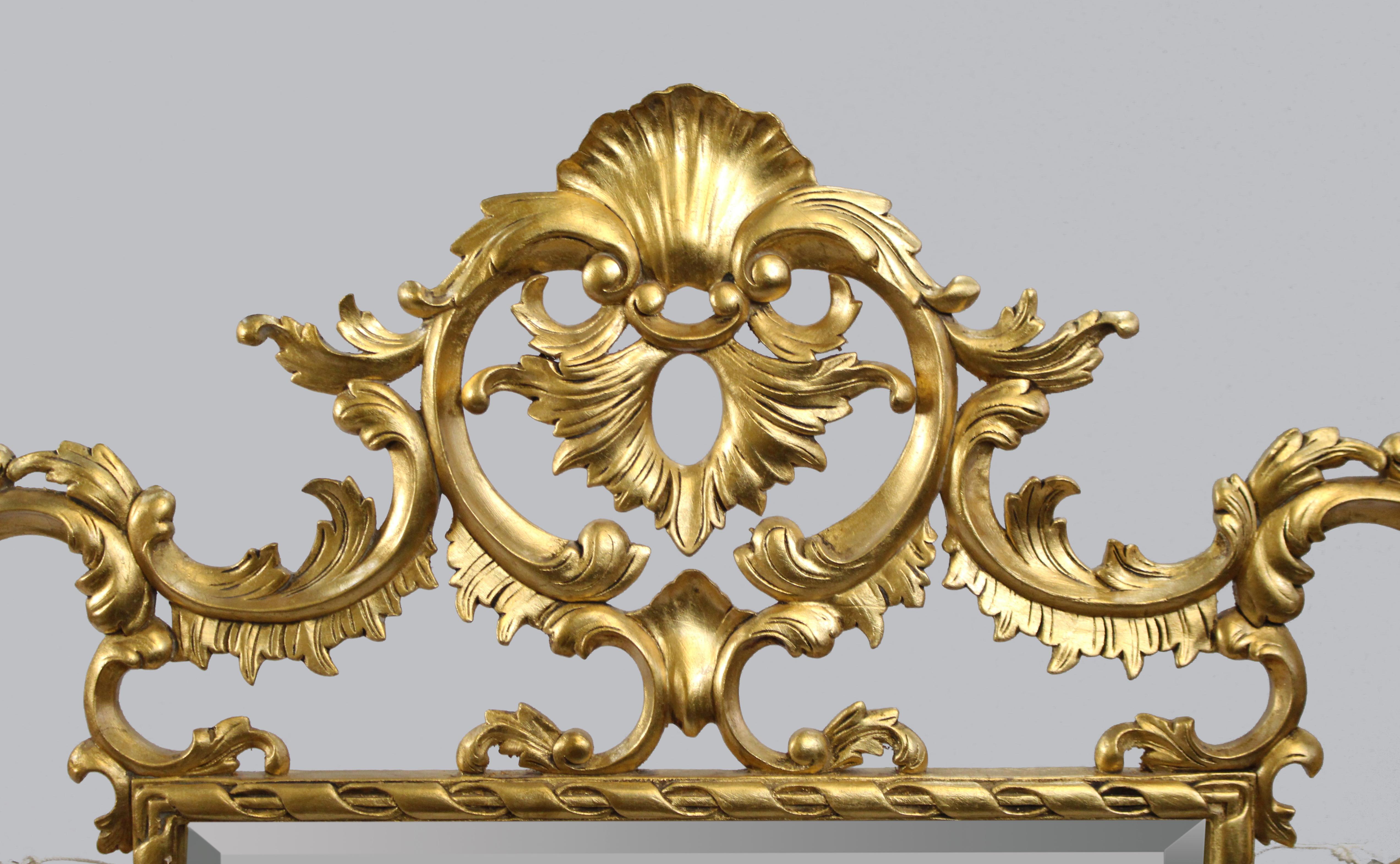 European Ornately Hand Carved Giltwood Bevelled Glass Mirror For Sale