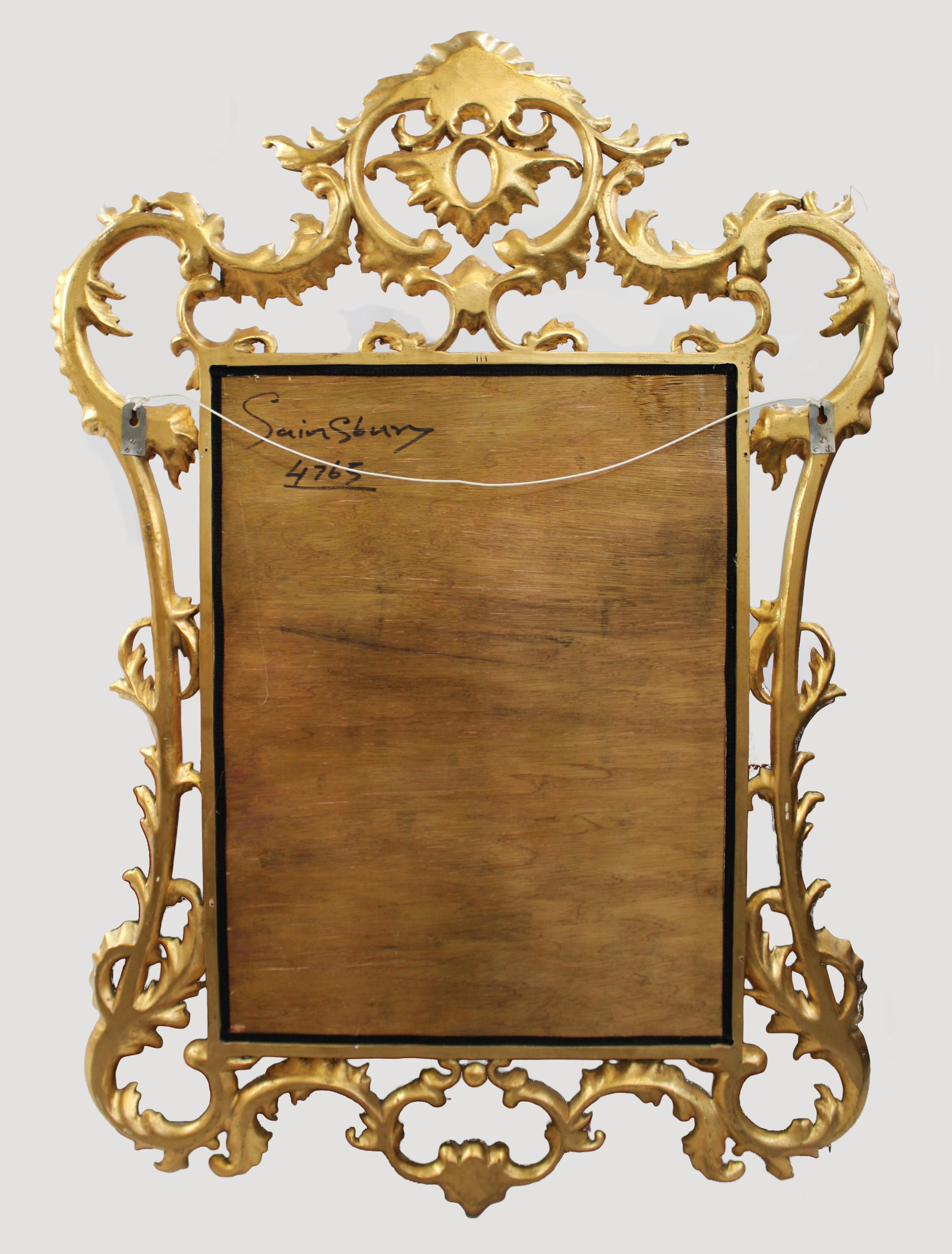 Ornately Hand Carved Giltwood Bevelled Glass Mirror In Good Condition For Sale In Worcester, GB