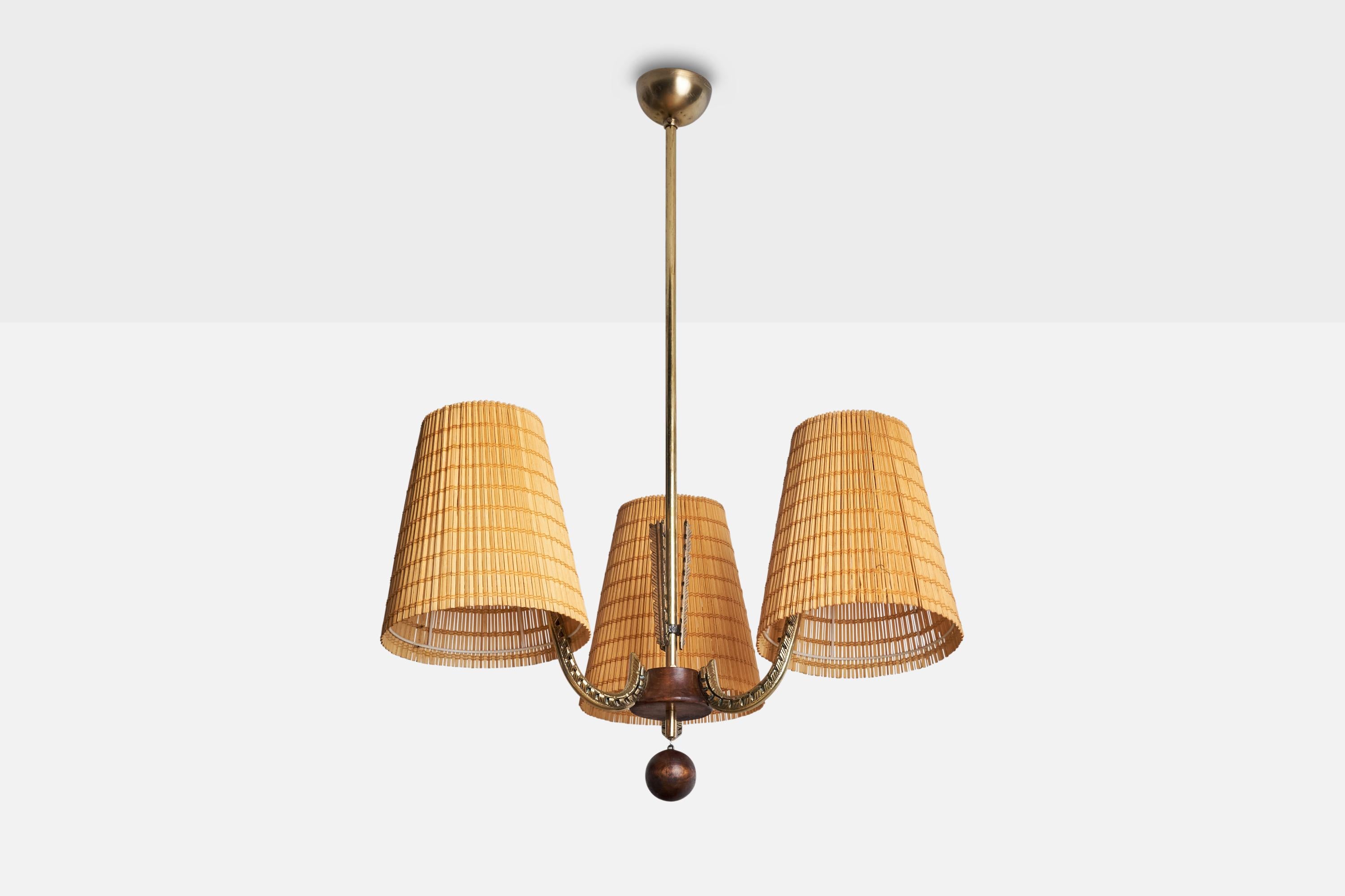A brass, stained birch and woven reed chandelier designed and produced by Ornö, Finland, 1930s.

Dimensions of canopy (inches): 2” H x 3.5” Diameter
Socket takes standard E-26 bulbs. 3 sockets.There is no maximum wattage stated on the fixture. All