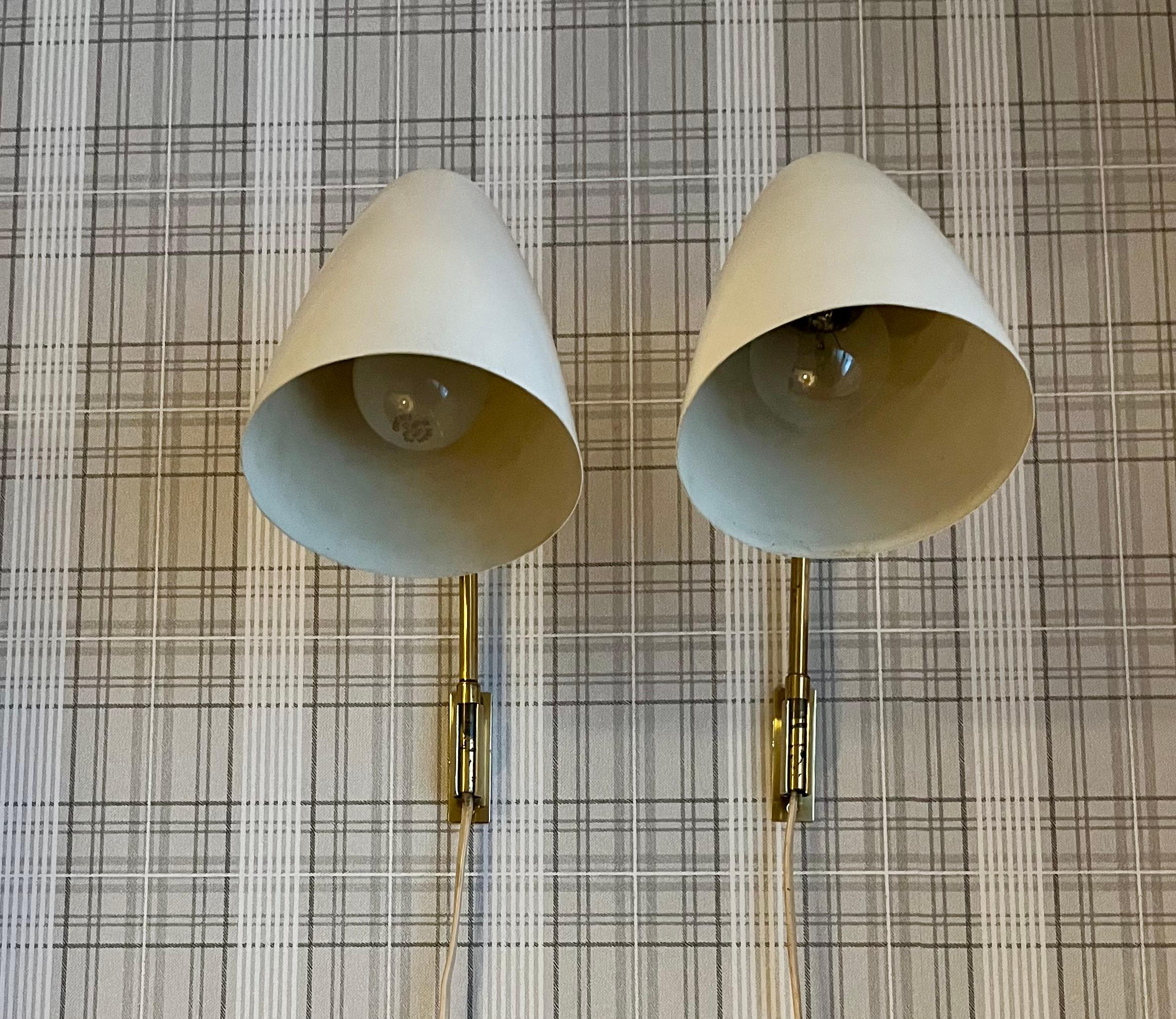 Lisa Johansson-Pape (1907–1989) was a Finnish designer and interior architect, renowned for her lighting design. Her designed wall lamp pair model 3054 represents her typical style, combining functionality and aesthetics.  ### Wall Lamp Pair Model