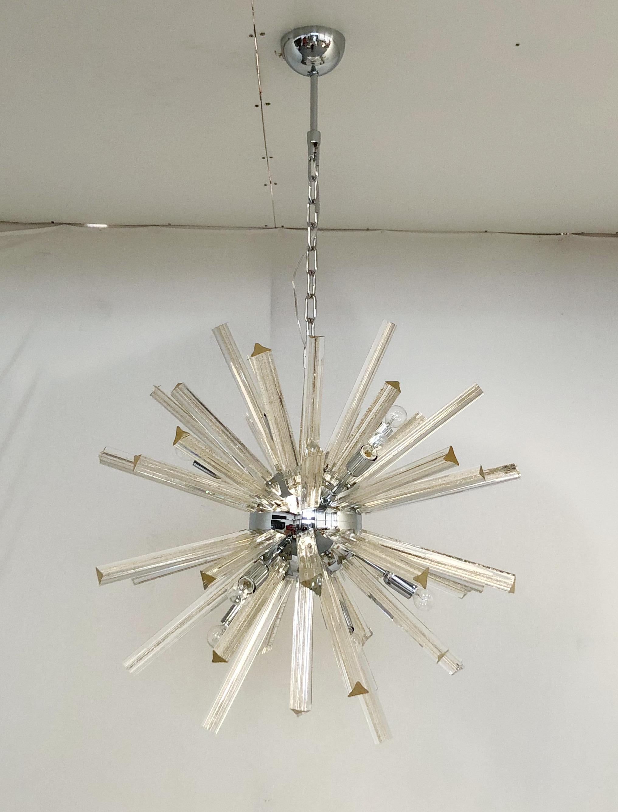 Italian Sputnik chandelier with Murano glasses hand blown into three points using Triedri technique and infused with gold flecks, mounted on polished chrome metal finish frame / Designed by Fabio Bergomi for Fabio Ltd inspired by Venini / Made in