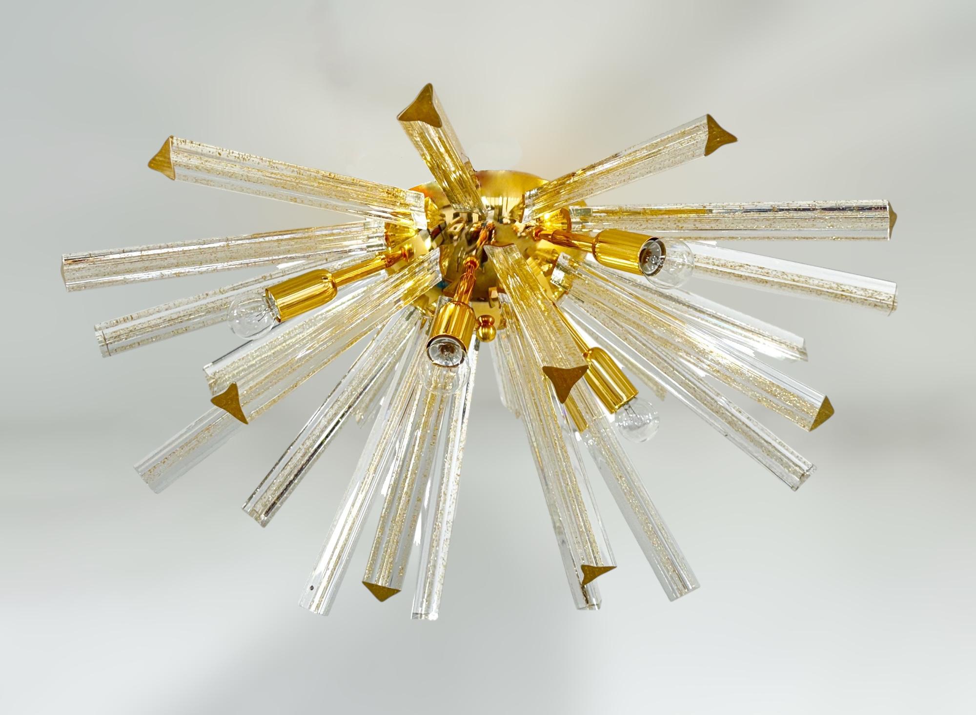 Italian sputnik flush mount with Murano glasses hand blown into three points using Triedri technique and infused with gold flecks, mounted on 24-Karat gold plated frame / Designed by Fabio Bergomi for Fabio Ltd inspired by Venini / Made in Italy
6