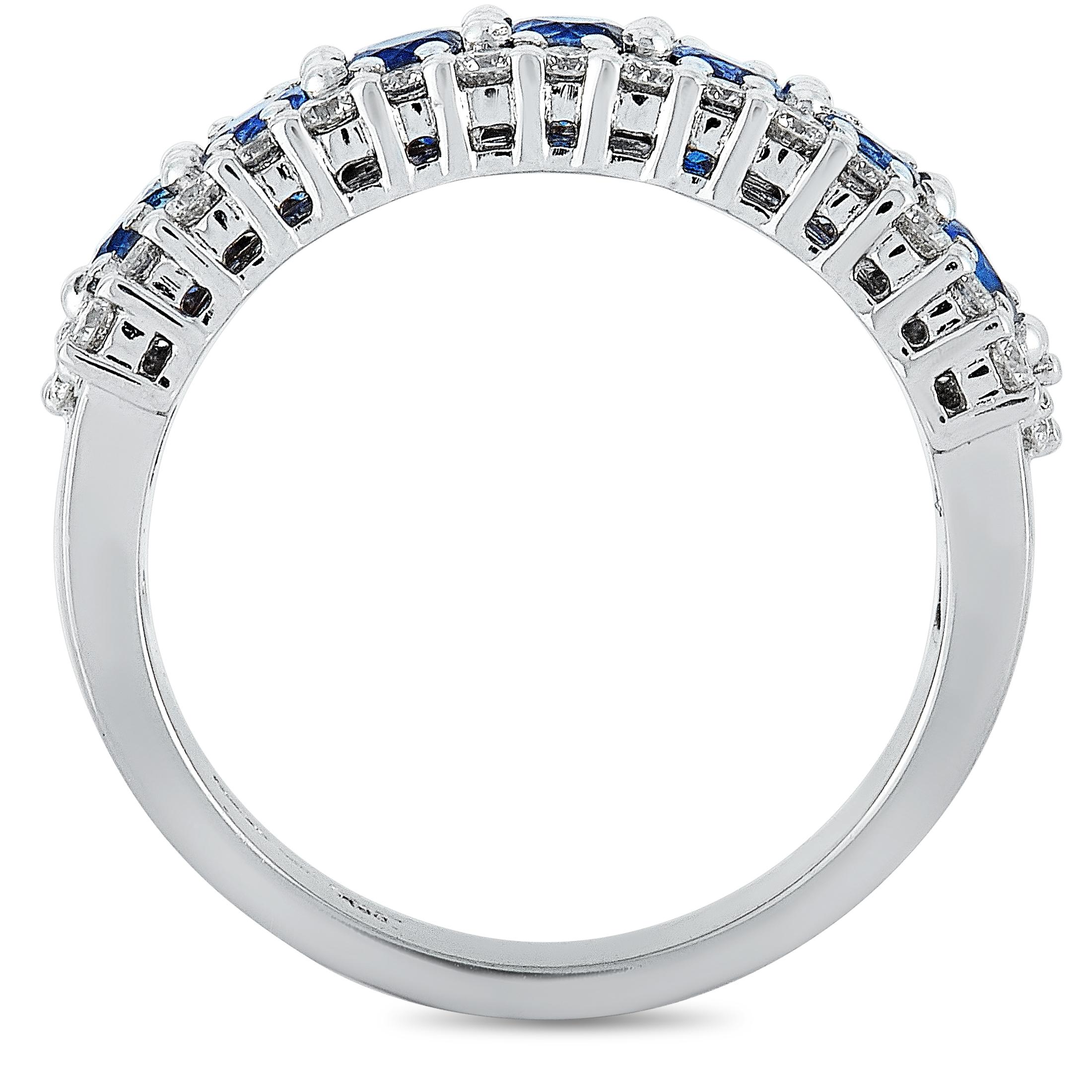 This Oro Trend ring is crafted from 18K white gold and set with diamonds and sapphires that total 0.85 and 1.47 carats respectively. The ring weighs 7.2 grams and boasts band thickness of 4 mm and top height of 3 mm, while top dimensions measure 21