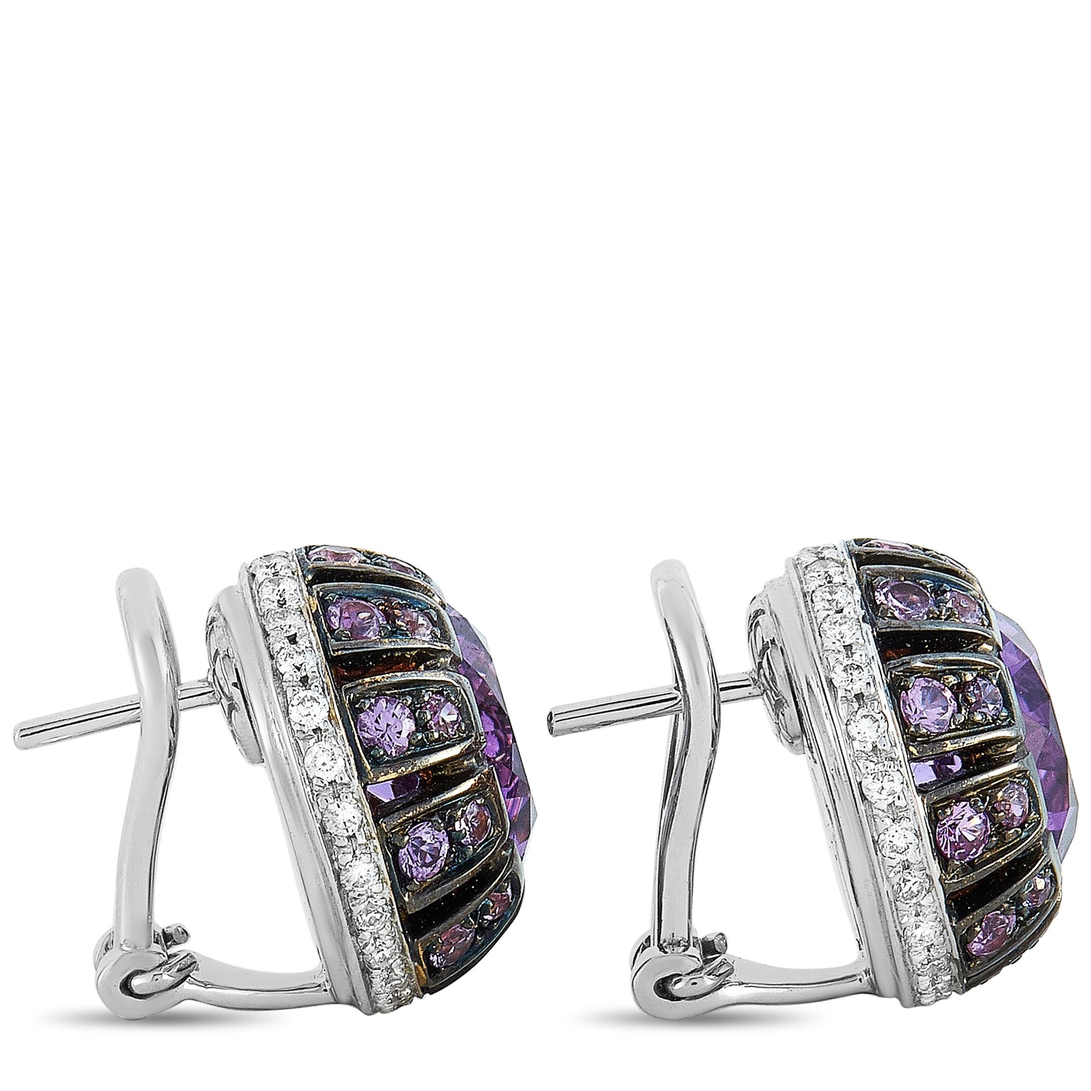 These Oro Trend earrings are made of 18K white gold and embellished with amethysts, a total of 0.45 carats of diamonds, and 1.06 carats of purple sapphires. The earrings measure 0.60” in length and 0.60” in width and each of the two weighs 7 grams.
