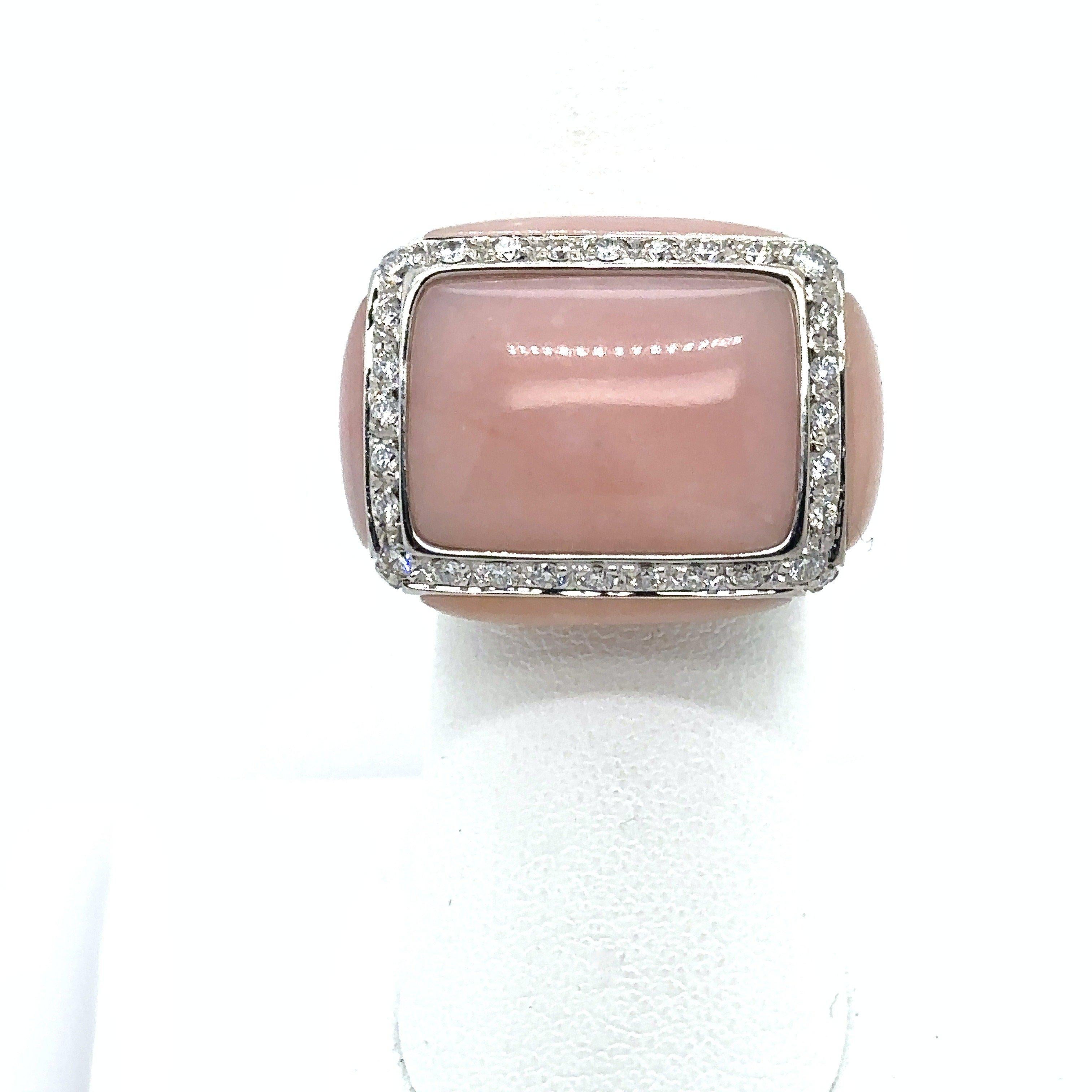 Oro Trend Baby Pink Coral and Diamond Cocktail Ring. This baby pink coral and diamond cocktail ring was crafted by Italian designer Oro Trend and set in 18KT white gold. The rectangular-shaped ring is framed by round diamonds along the top and the