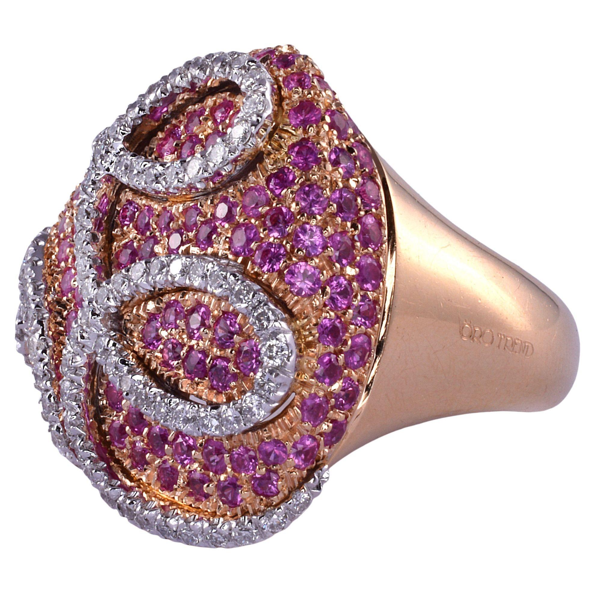 Estate Italian Oro Trend pink sapphire & diamond 18K rose gold ring. This estate ring is crafted in 18 karat rose and white gold by Oro Trend. This Oro Trend ring features 2.56 carat total weight of pink sapphires and .77 carat total weight of