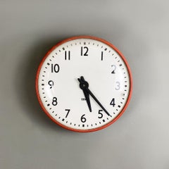 Wall clock, Italian red metal and glass wall clock by IBM, ca. 1960.