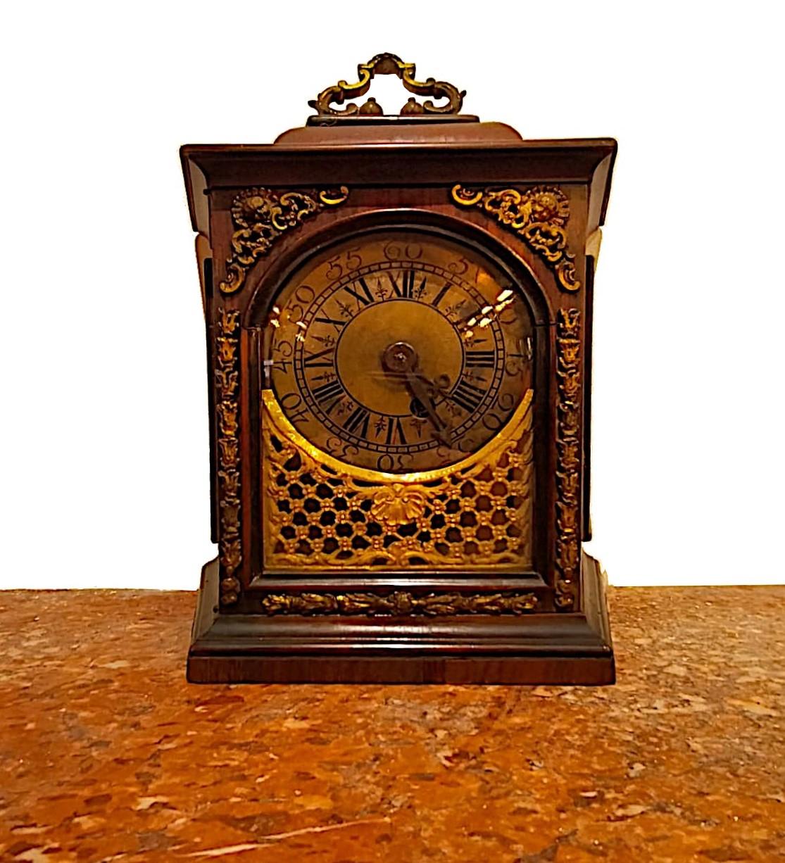 Italian Table clock from the early 1700s,  rosewood and gilded bronzes For Sale