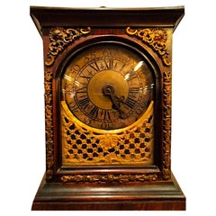 Antique Table clock from the early 1700s,  rosewood and gilded bronzes