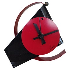 Radical Memphis style table clock, lacquered metal, 1980s