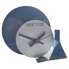 Radical Memphis style table clock, lacquered metal, 1980s