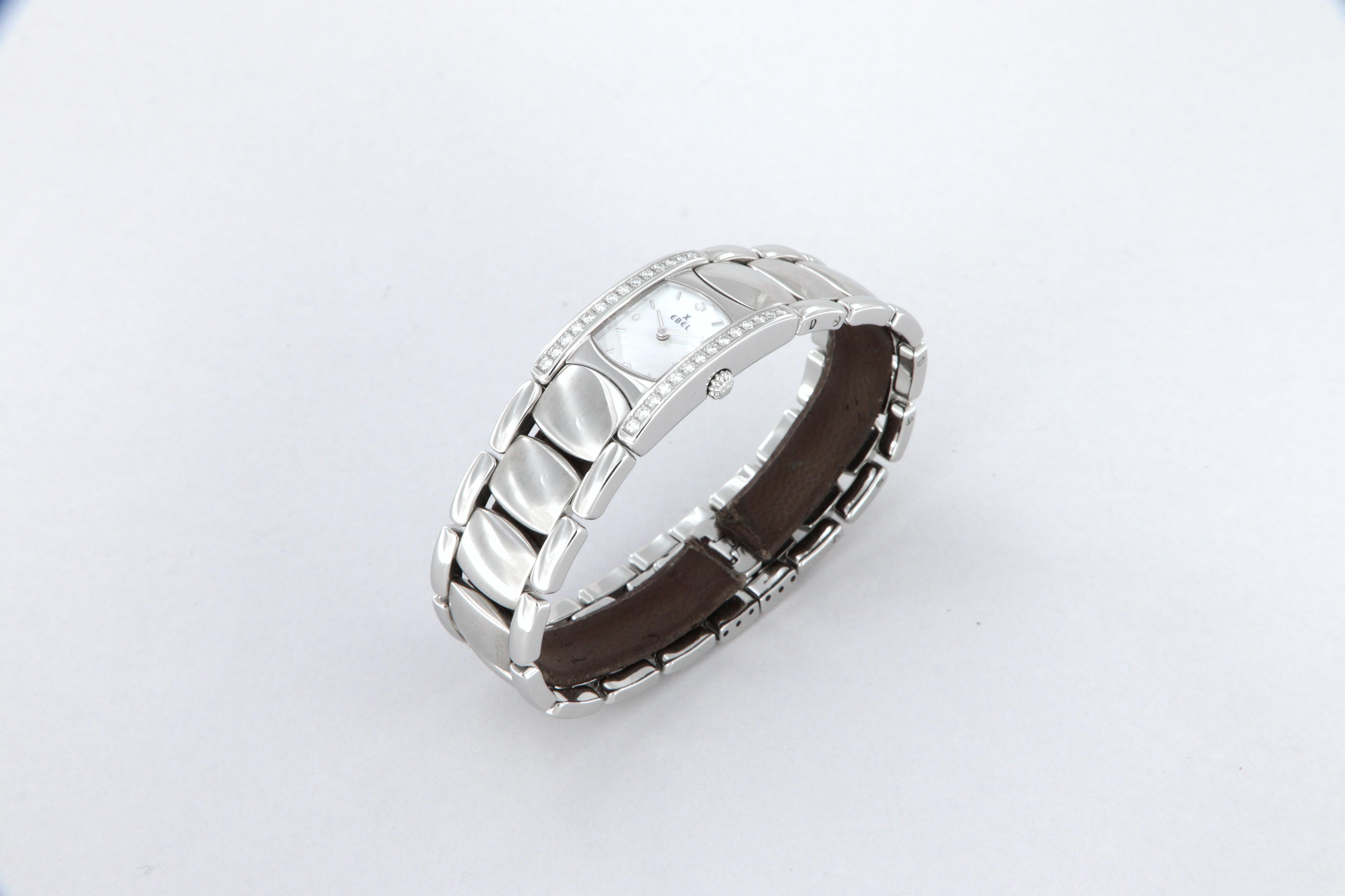 Ebel Beluga Manchette quartz steel and diamond watch new ref 9057A28
Total weight g 78
Case measurements mm 36 x 19
Steel case with 28 diamonds
Mother of pearl dial 4 diamond indexes
Quartz Movement 
Sapphire crystal
Waterproof 5 atm
Original