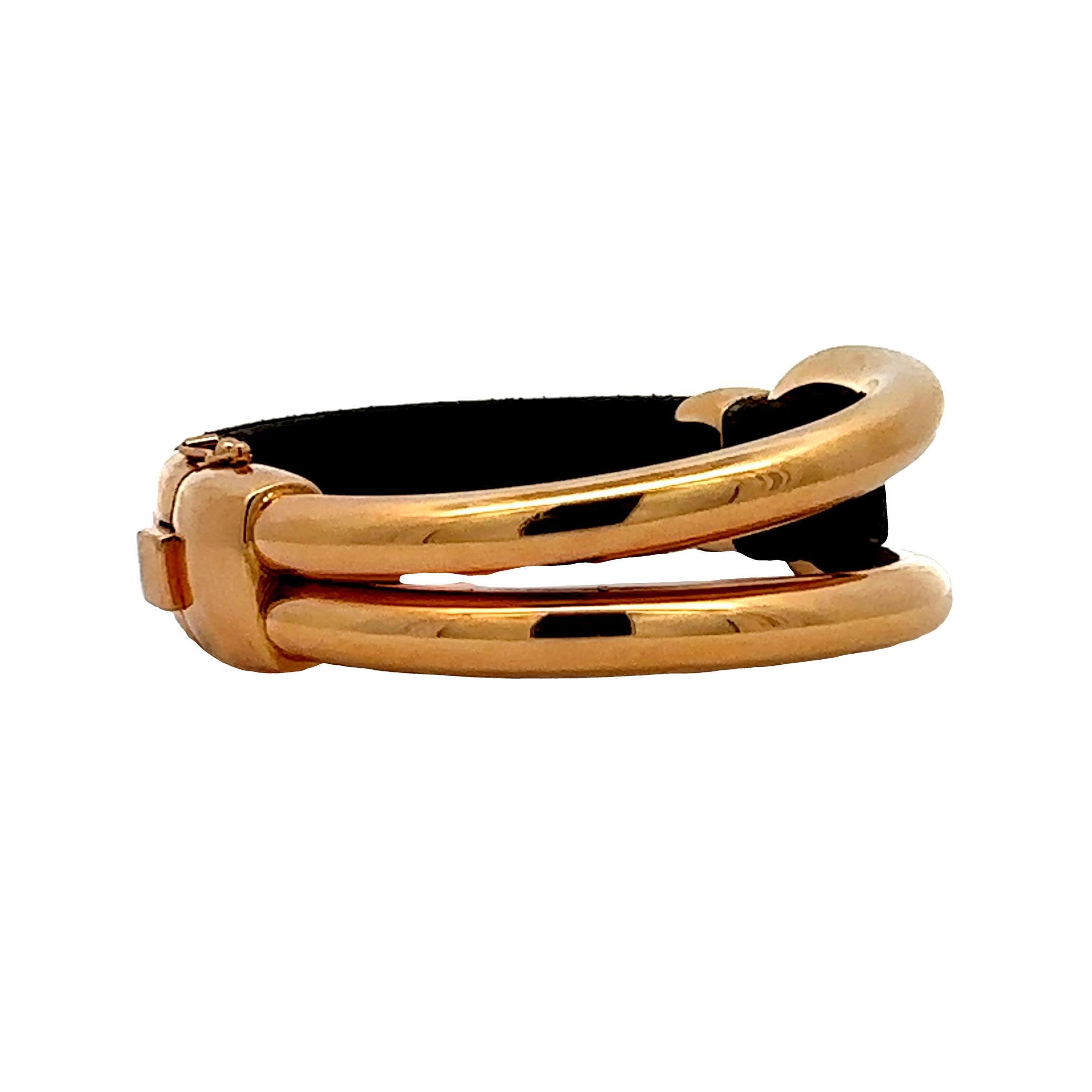 Oromalia Italian made bracelet, offered by Alex & Co. This fashionable bracelet features a bold rose gold oval tubular semi cuff style centerpiece weighing 26 grams. The piece is secured by a brown natural leather strap with a rose gold accent. The