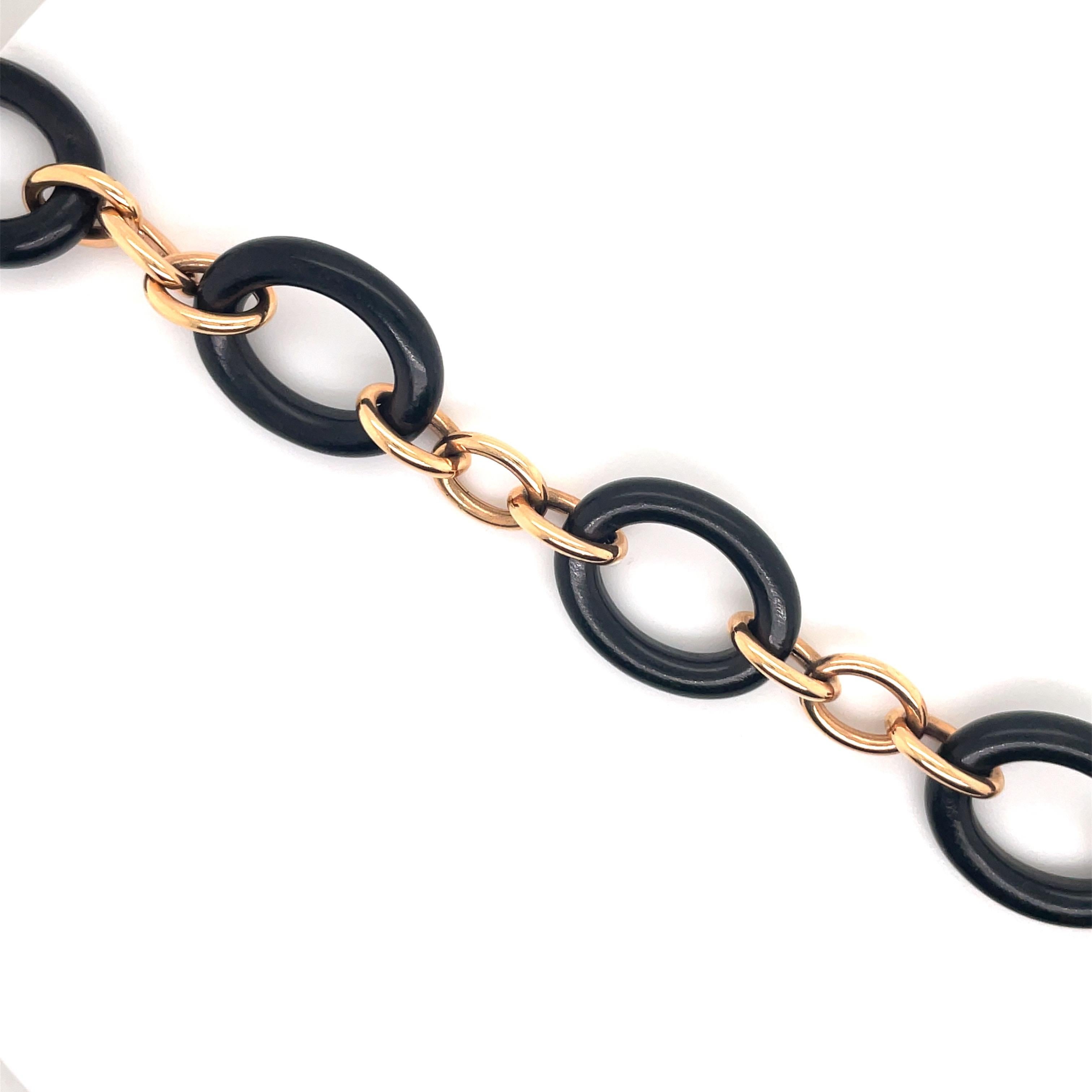 OROMALIA link bracelet featuring 5 Ebony Oval wood links between each section of 3 rose gold links.
Wood Link 1 inch x 0.75 inches
Rose Gold Link 0.50 inches x 0.38 inches
Can be shortened 