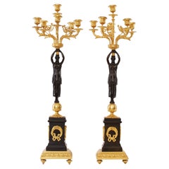 Oromolu with Patina Bronze and Marble Plinth Candelabras