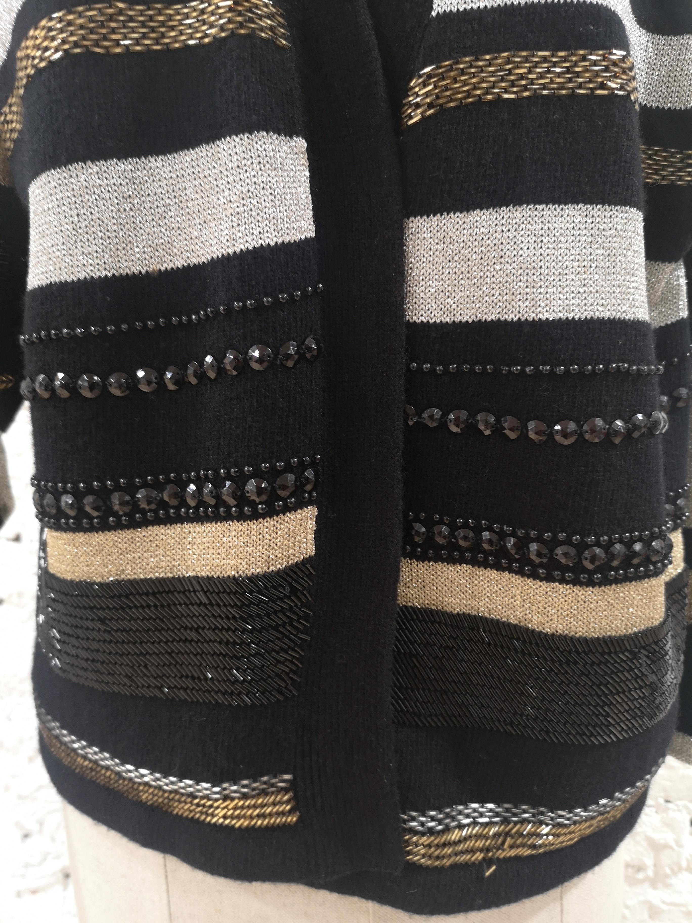 Oronero twin-set shirt and cardigan black gold silver wool
embellished with beads
totally made in italy in size S
