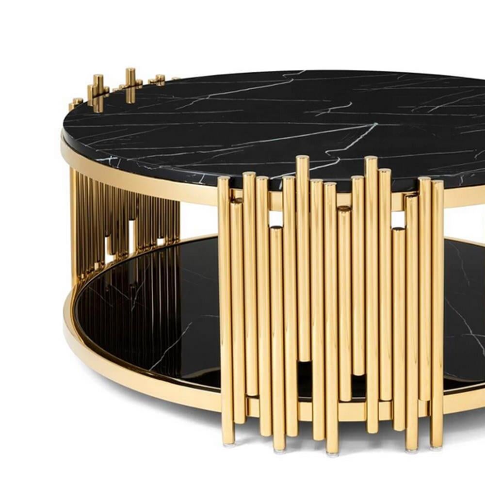 Coffee table ororods round with steel structure 
in gold finish and with black resin marble up and 
down tops.