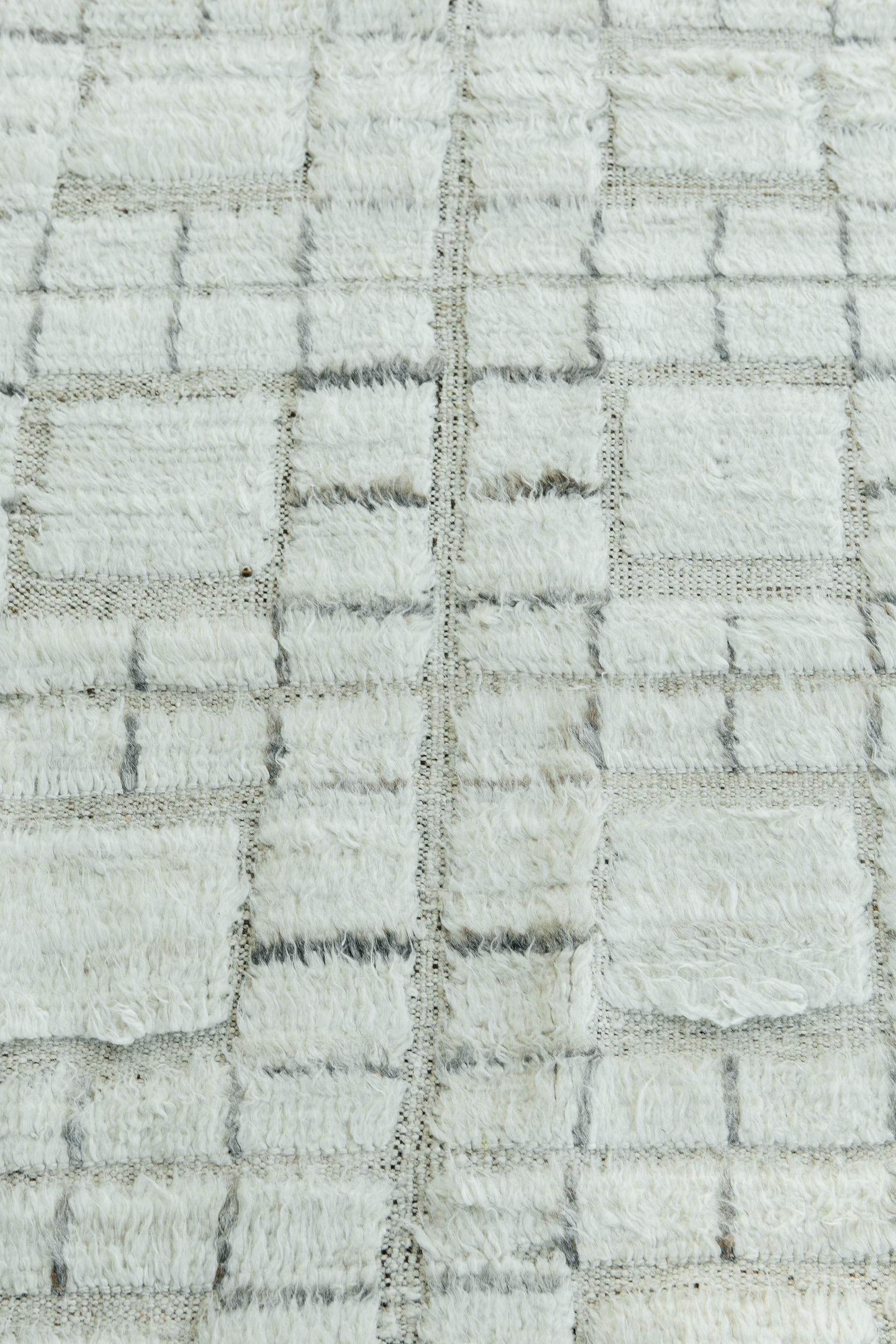 Oroshi is named after strong Japanese winds. This piece from Mehraban's Haute Bohemian collection has timeless checkered design elements and natural earth tones with the perfect shade of white shag and peppered ivory weave. Oroshi is also bordered