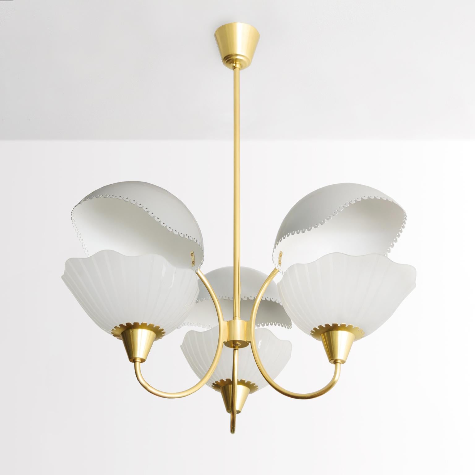 Harald Notini designed for Orrefors 1940’s chandelier with 3 striped etched shades and 3 lacquered in white and gray reflector shades. The brass frame has been newly polished and lacquered and the fixture has be newly rewired with standard base