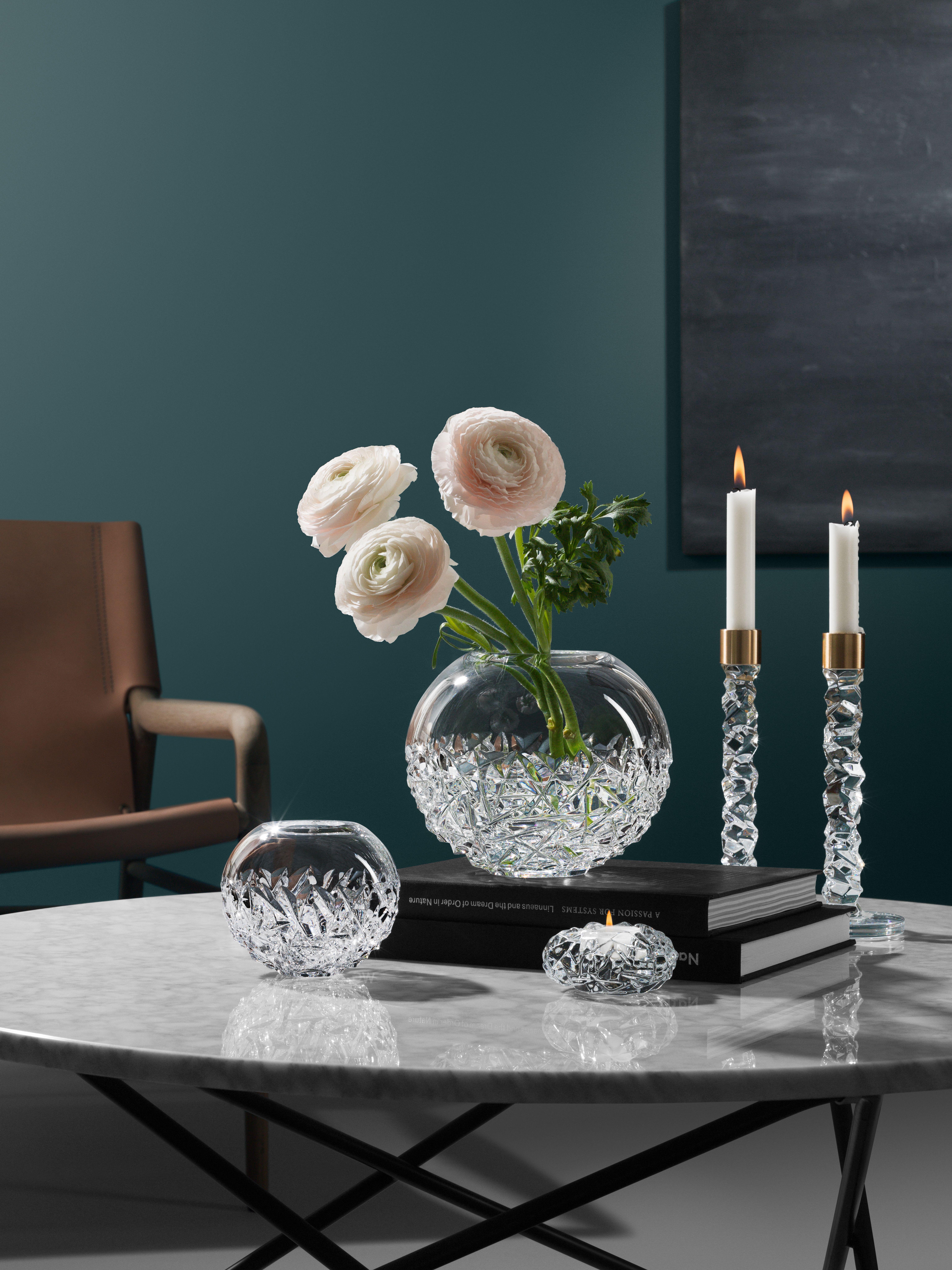 The Carat collection is based on a contemporary interpretation of the traditional cut glass for which Orrefors is world-renowned. The Carat Votive candle holder, available in two sizes, is covered with the collection’s characteristic asymmetrical
