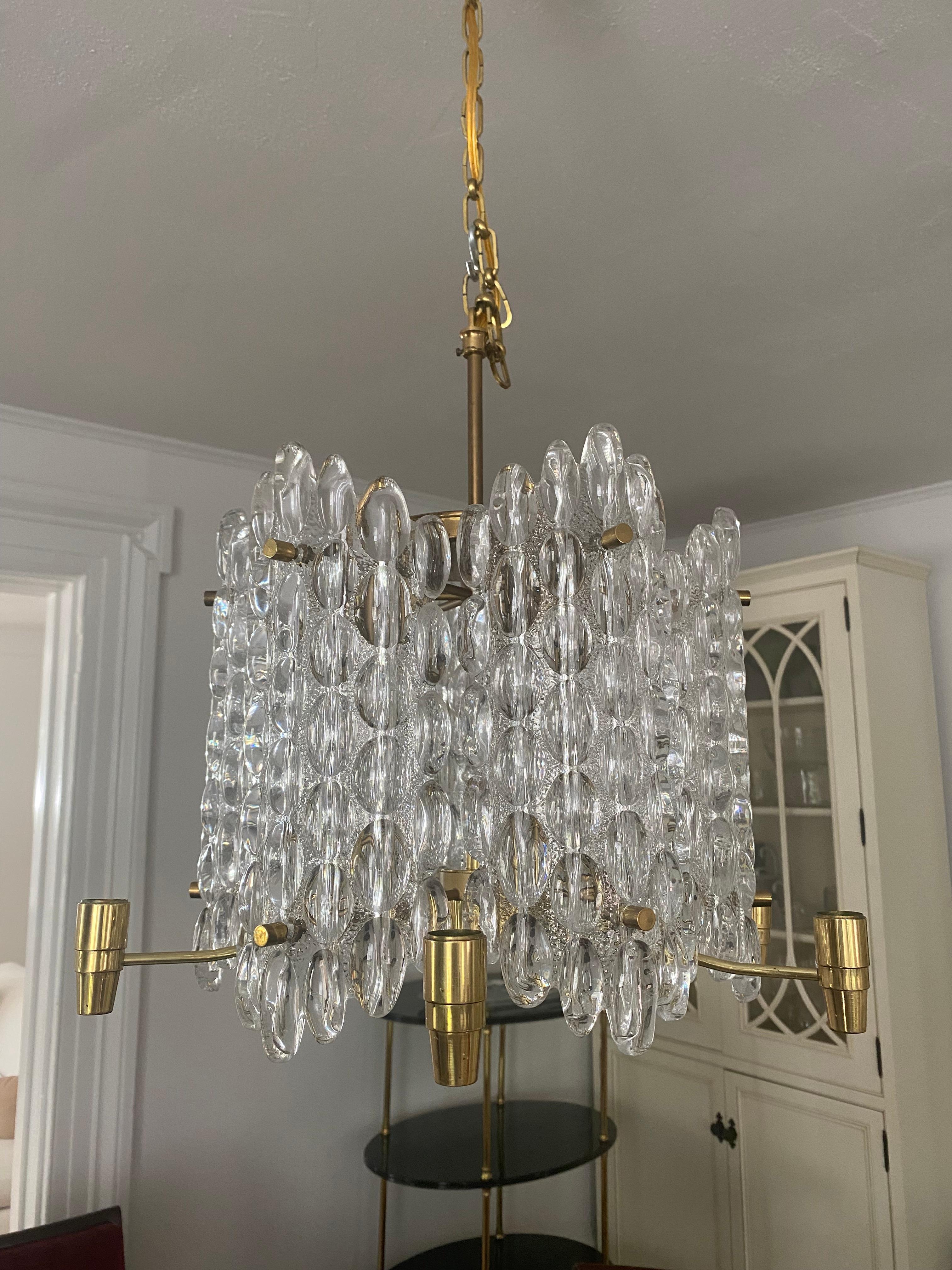 Carl Fagerlund for Orrefors crystal chandelier.
Six hanging panels with 6 candleholders.
Hanging dimensions can be adjusted.
Well crafted and heavy.

Comes apart for shipping.
Approx 16 diameter x 12 inches high.
