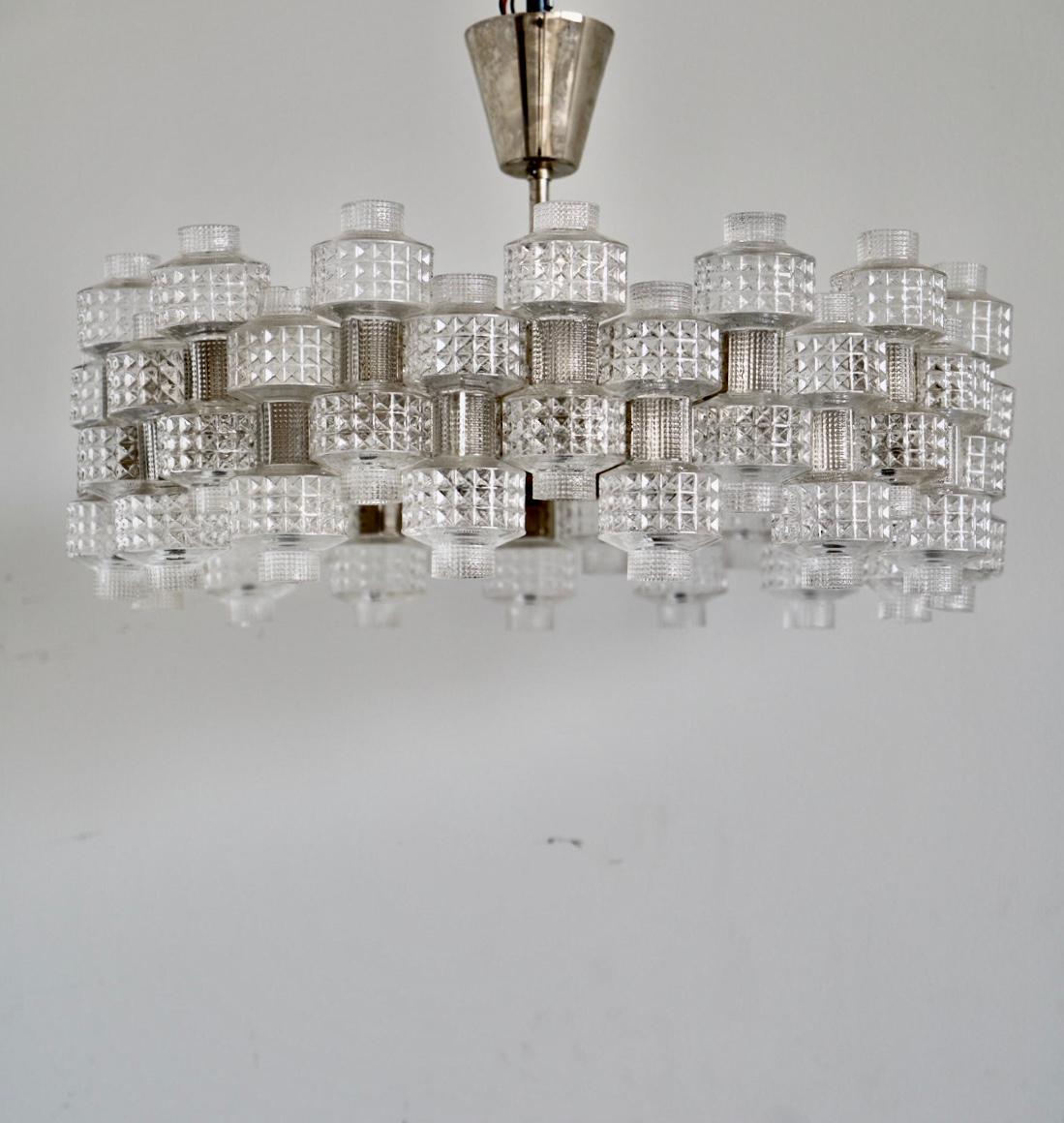 A chandeliers model festival designed by Gert Nyström, Circa 1950s.
Glass parts by Orrefors. Early production with metal clips. 6 E27 Sockets.
Existing wires, rewiring available upon request.