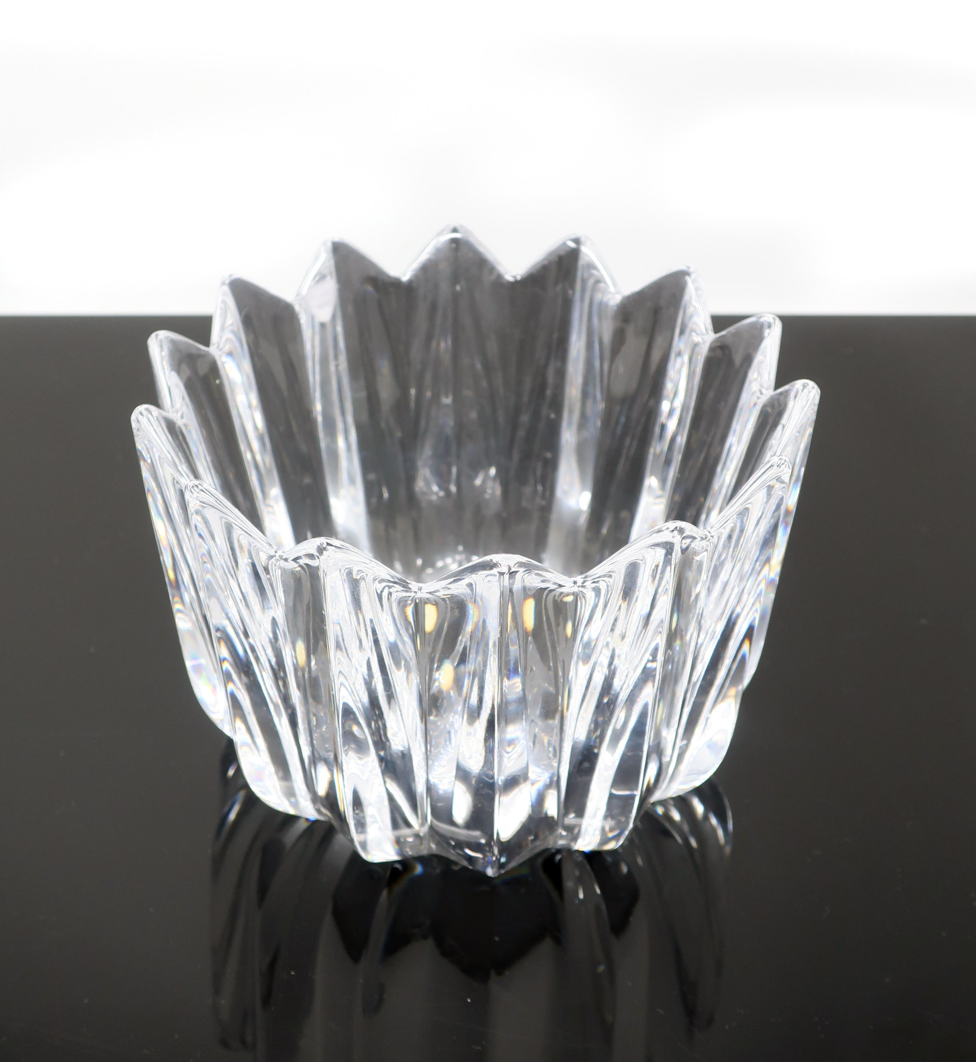 A lovely vintage crystal bowl in the Fleur pattern designed by Jan Johansson, an artist who began work for Orrefors in the 1970s. The design is reminiscent of a blooming flower or a crown. In excellent condition with no chips or cracks. Signed in