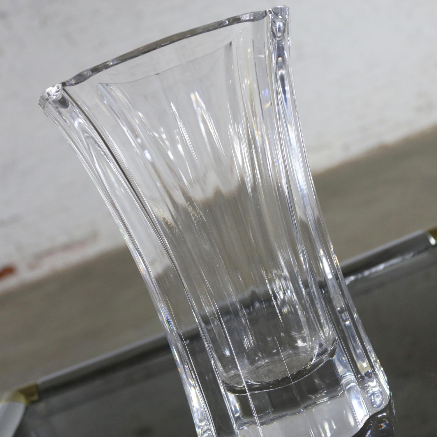 Beautiful 8 inch tall crystal vase designed by Lars Hellsten for Orrefors. It is signed and numbered LH 4599-22 and in fabulous vintage condition, circa late 20th-early 21st century.

What a lovely crystal vase for a beautiful bouquet or just