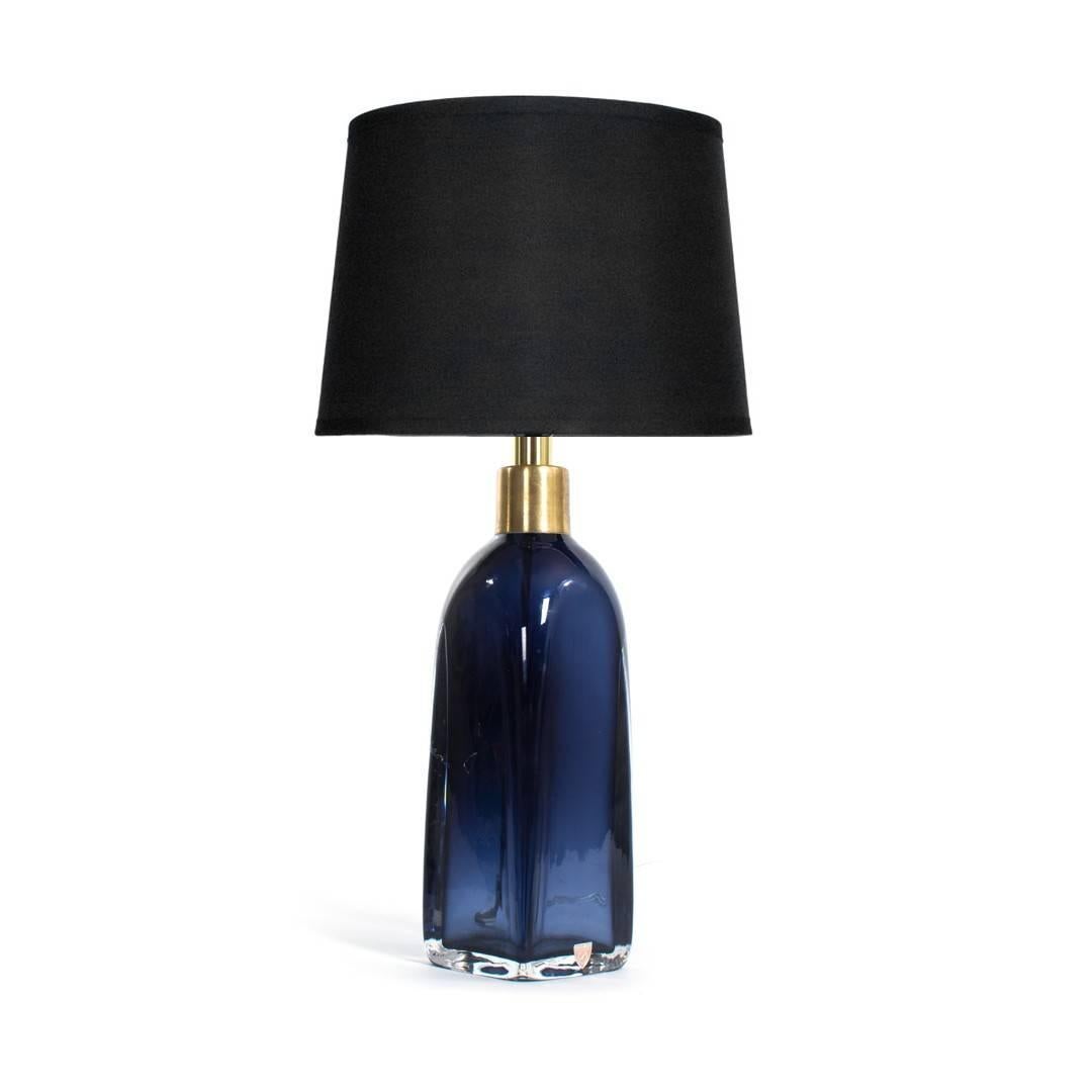 A deep blue glass table lamp by Orrefors, Sweden, circa 1970. Shade not included. Wired for U.S.; takes one bulb, 60 watts max. Measures 14 inches tall.