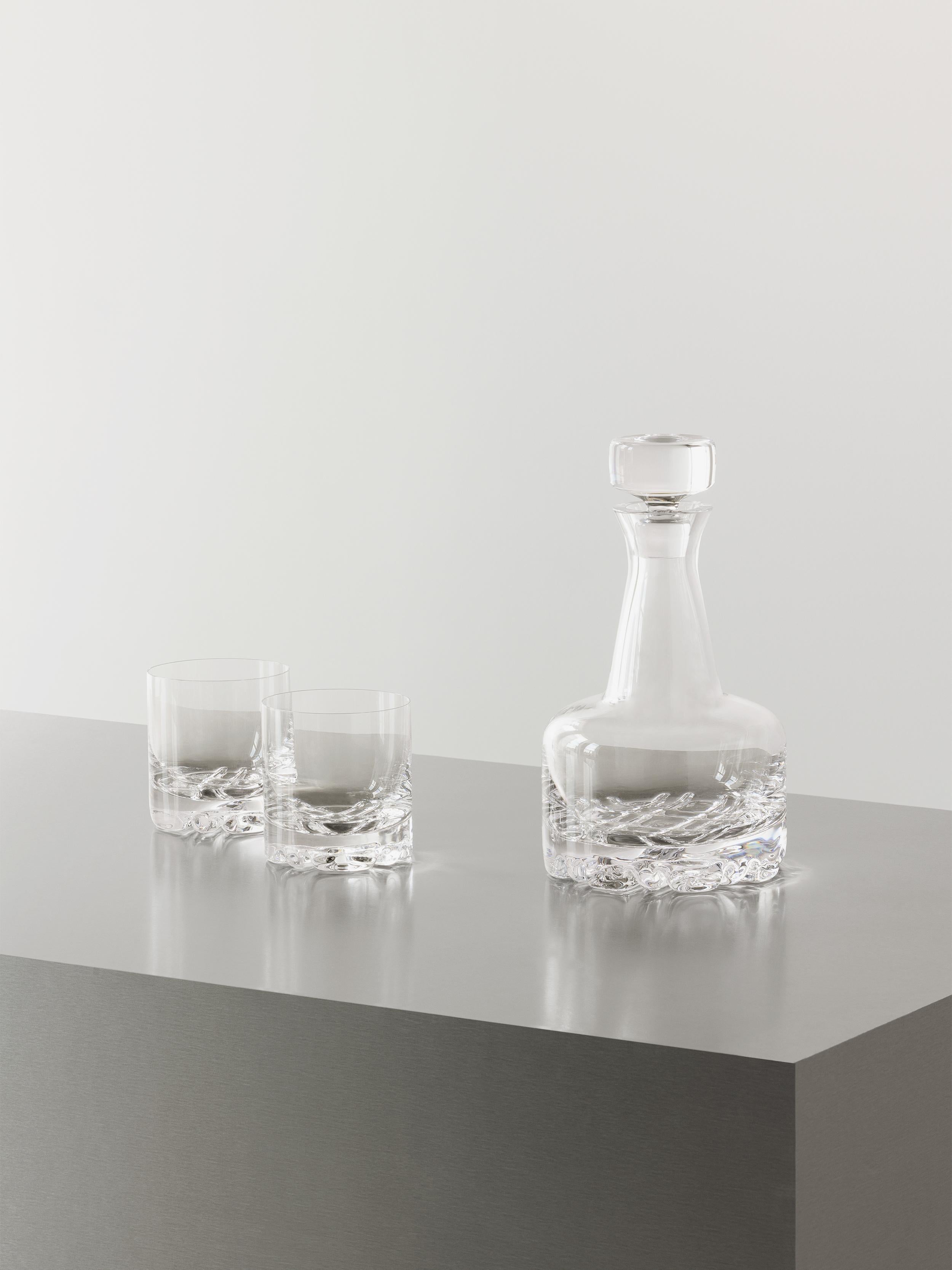 The Erik 3 Piece Set from Orrefors consists of one decanter and two DOF glasses. A perfect set for all whiskey enthusiasts appreciating modern 70s design distinguished by Scandinavian simplicity and clean lines. The decanter, holding 26 oz, allows