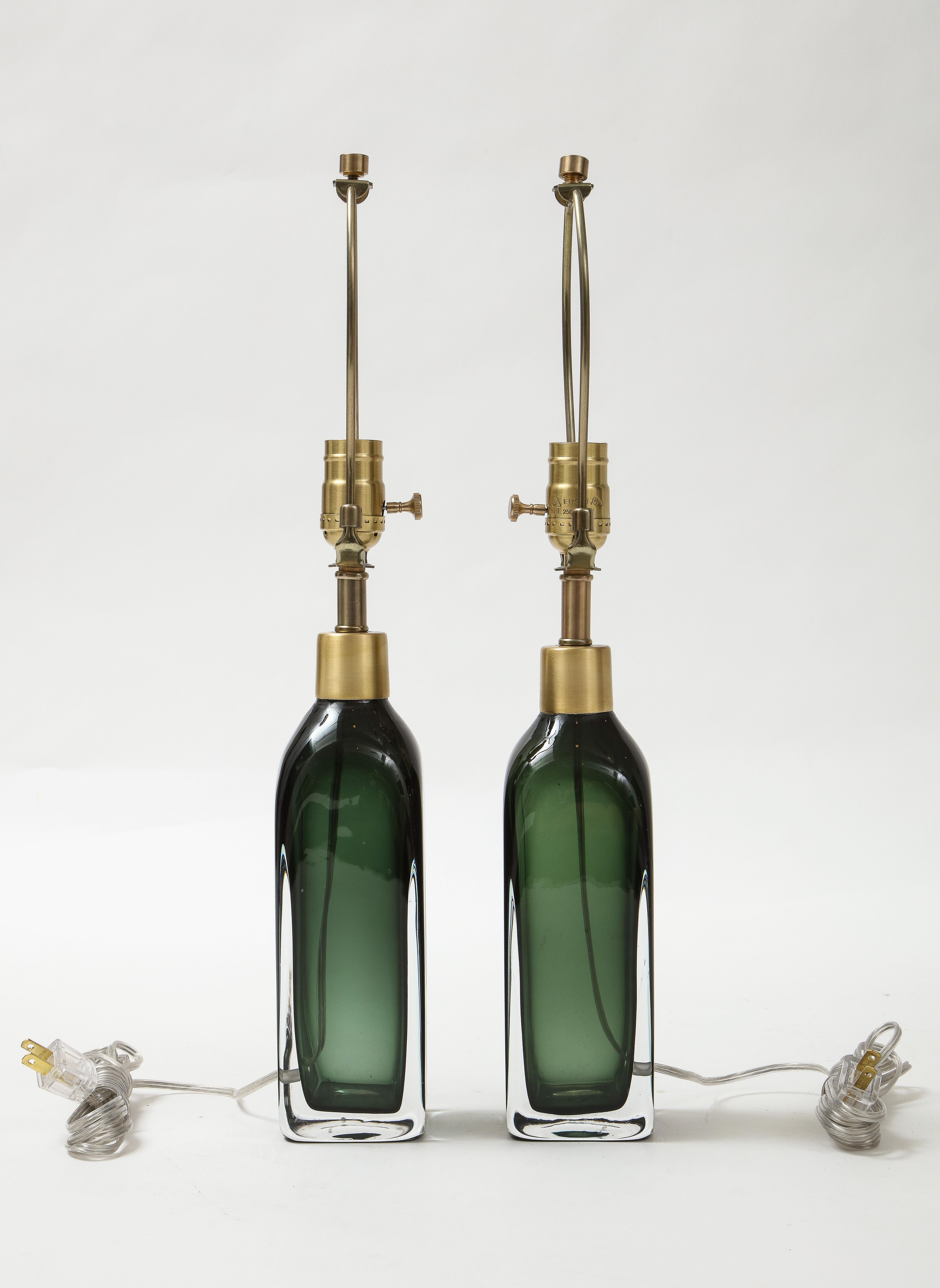 Pair of squared off bottle form cystal lamps in forest green with satin brass hardware. Professionally wired and buffed. 100W Max.