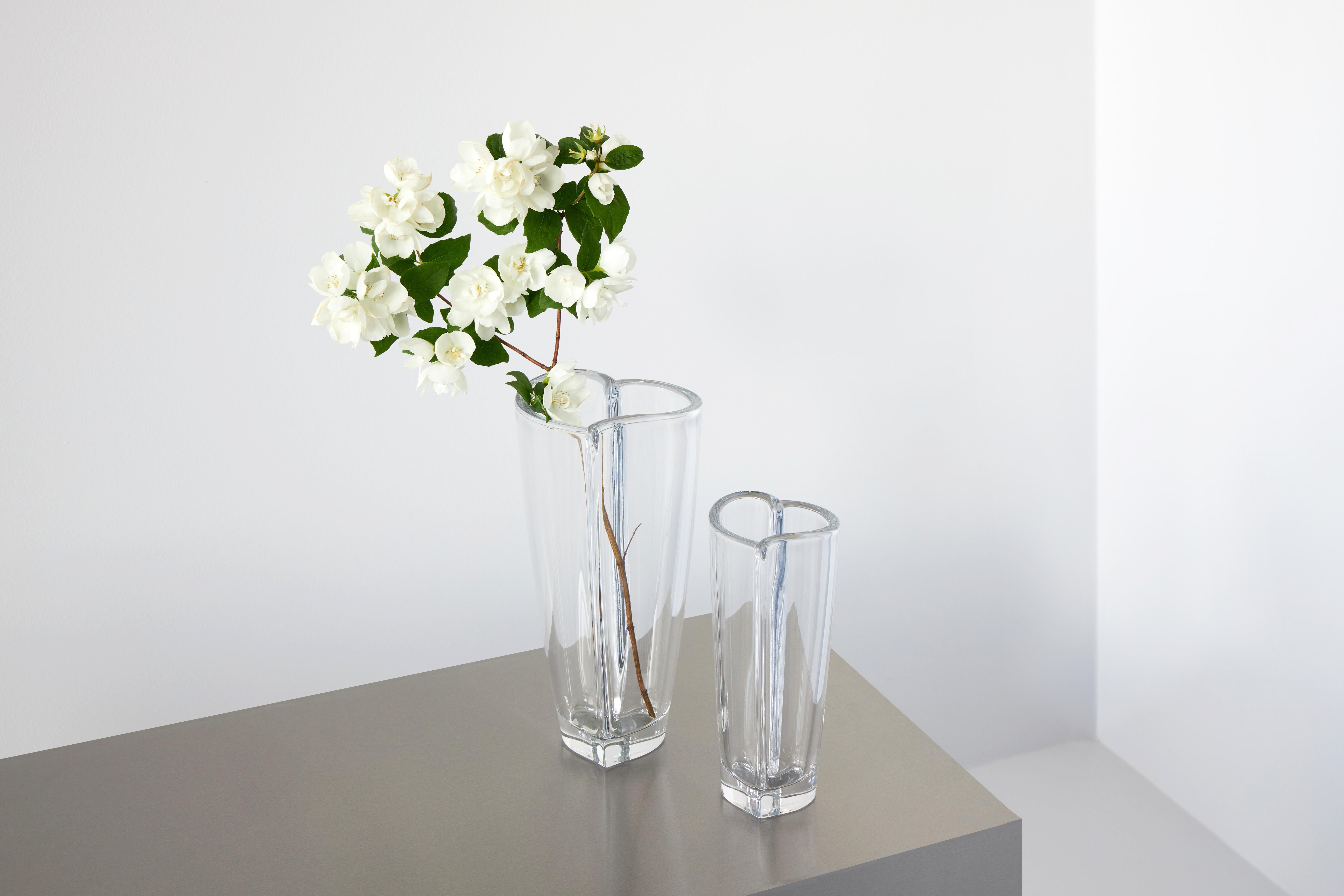 The Heart Vase from Orrefors is shaped like a heart, with rounded edges giving it a delicate look. It represents affection and love, the perfect gift for someone you care about. Heart Bud Vase, which is both decorative and functional, is suitable