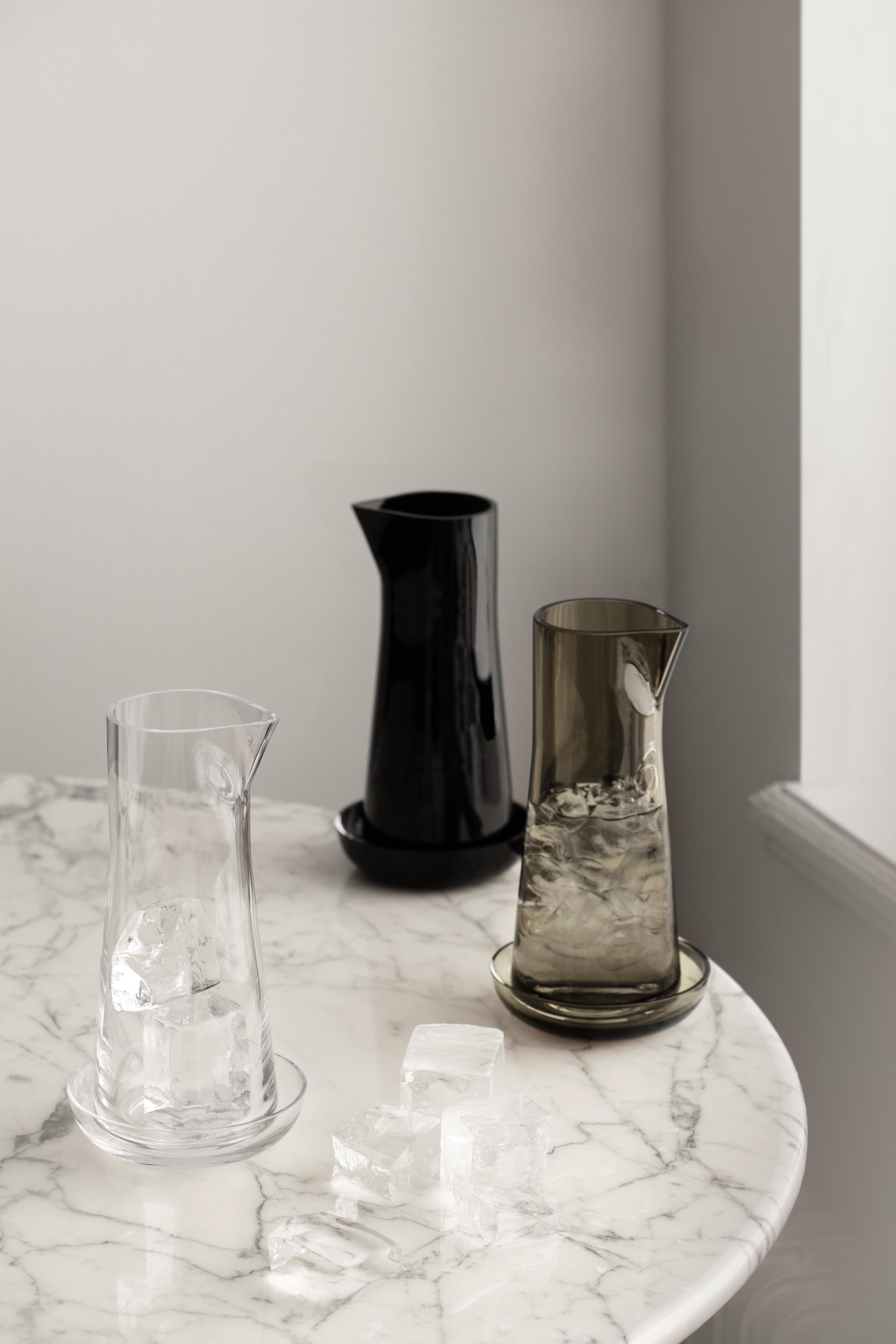 The Informal carafe in black from Orrefors holds 34 oz and is the centerpiece of the collection. It has a characteristic spout and includes a small bowl that can be used as a coaster for the carafe. The bowl is also perfect for serving nuts, olives,