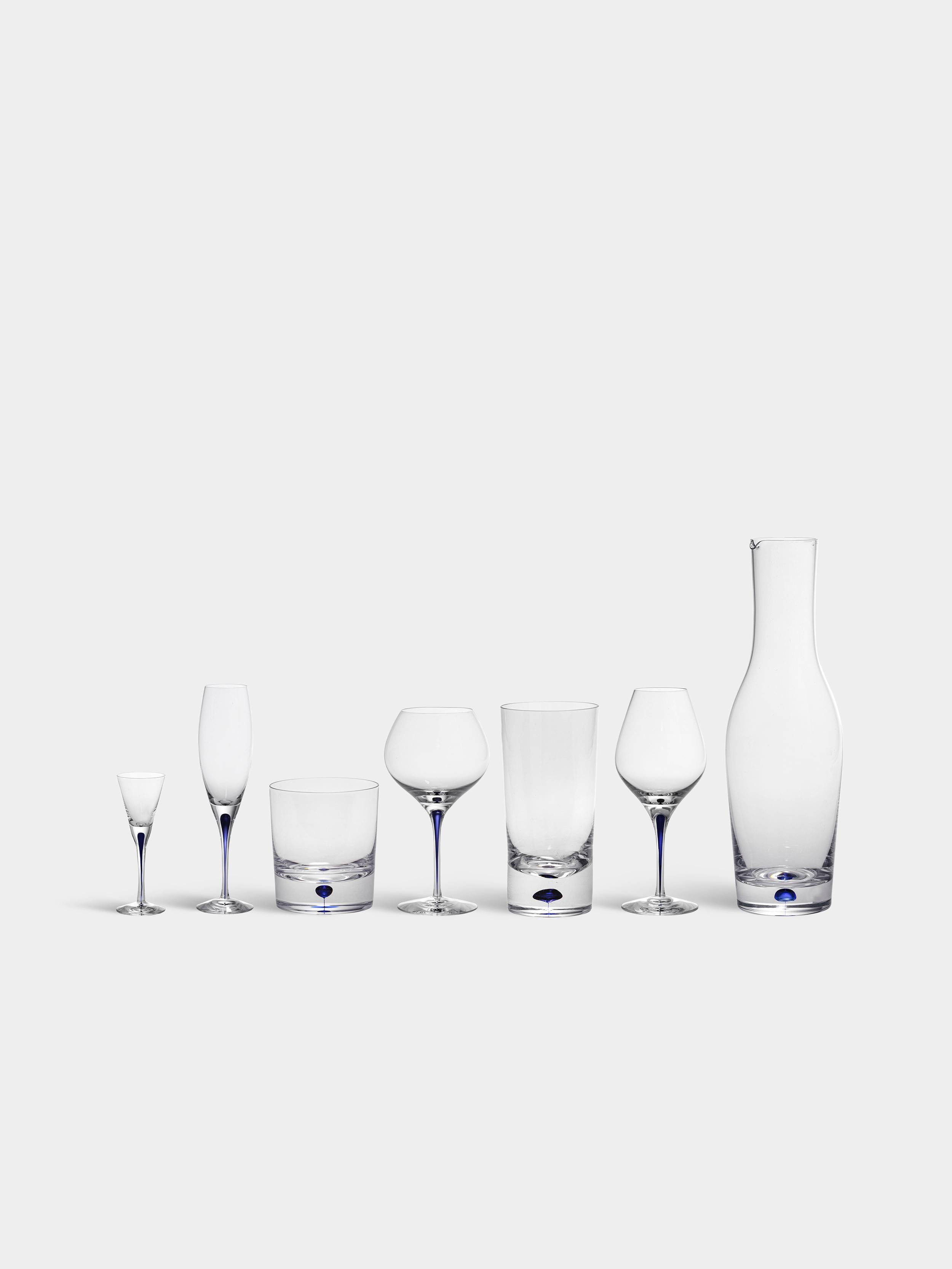 Intermezzo Snaps from Orrefors was designed in 1984. The glass, which holds 2 oz, is ideal for serving spirits. Intermezzo Snaps is mouth-blown in Sweden by expert glassblowers and has a drop of blue sealed inside the stem – an innovation based on