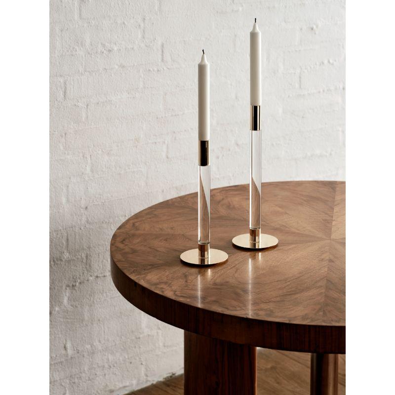 Lumiere from Orrefors has a contemporary expression based on the designer's, Ingegerd Råman, moderate approach. The candlestick is a minimalistic combination of the materials glass and golden metal.
