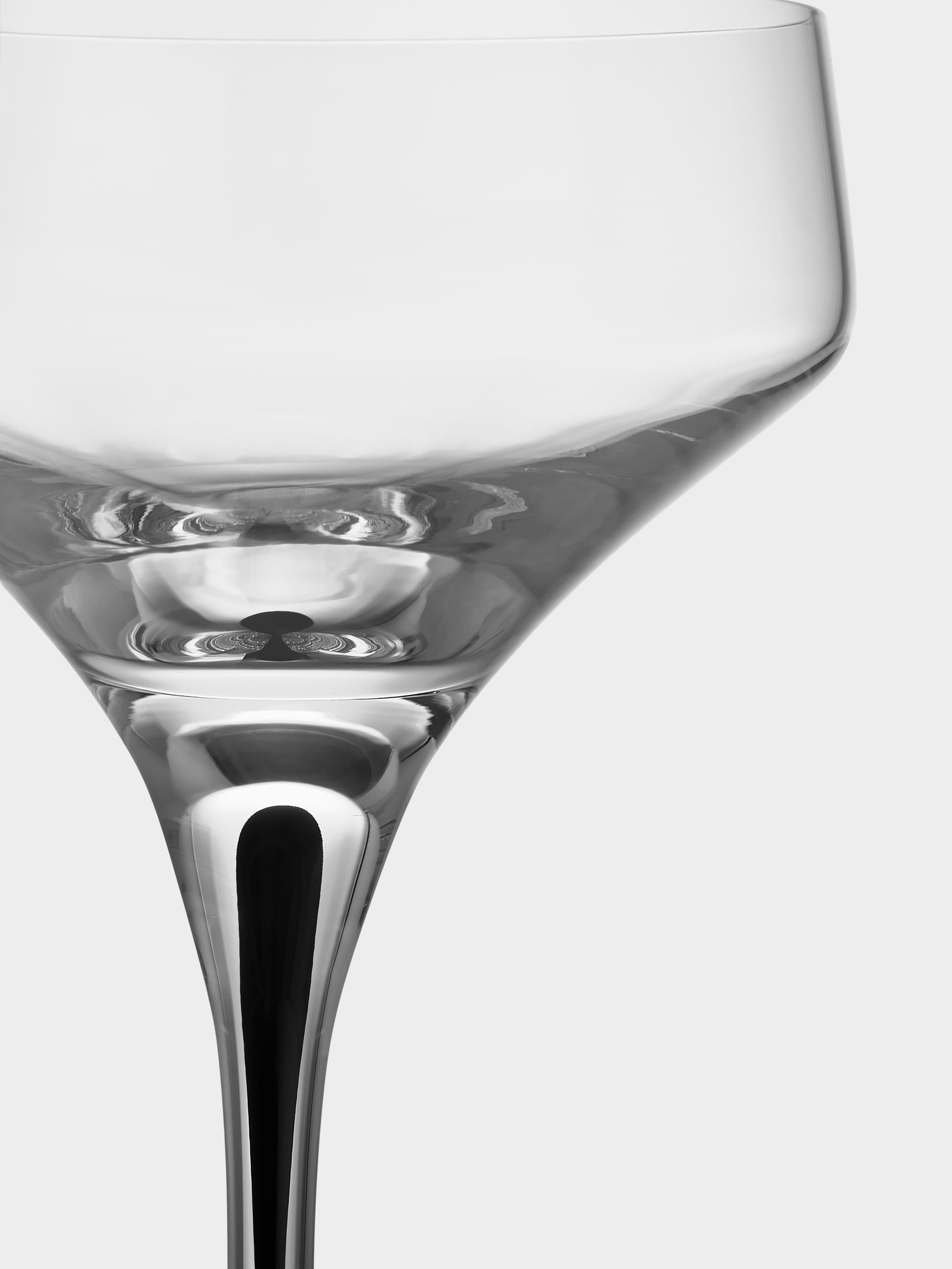 Metropol Coupe from Orrefors, which holds 8 oz, is ideal for sparkling beverages, as well as cocktails, with the wide bowl delivering elegance to the drink. It is also outstanding for serving smaller cold dishes or desserts. The coupe glass is