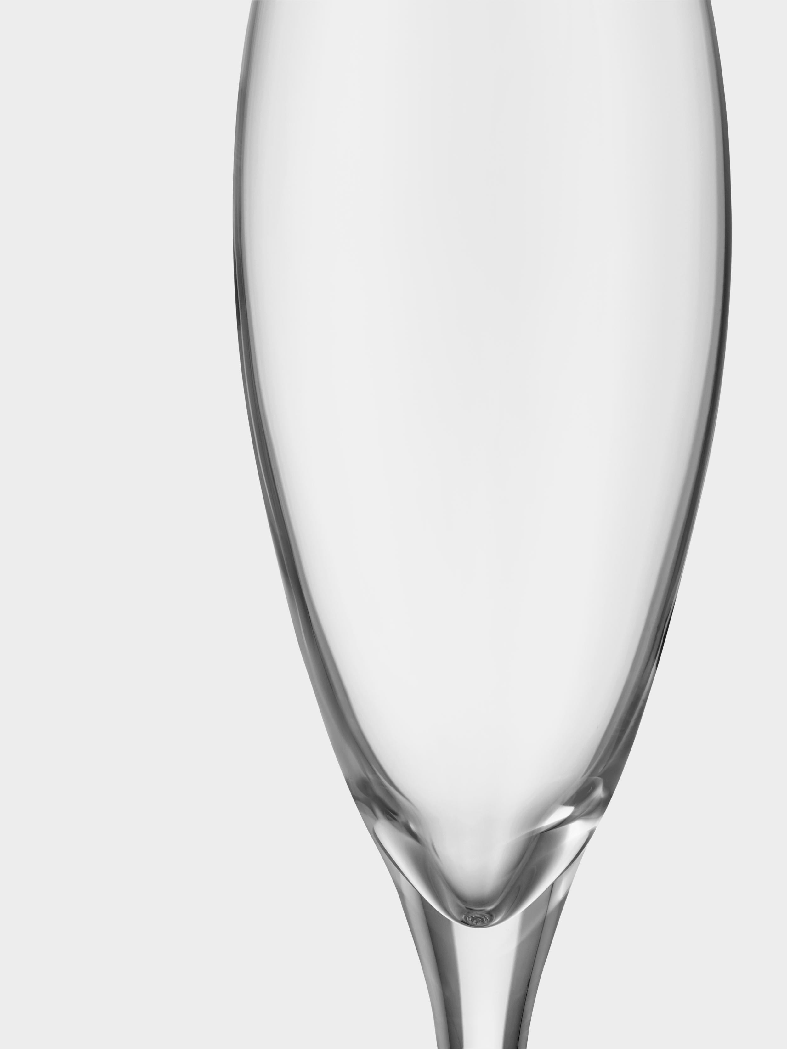 More Champagne from Orrefors, which holds 5 oz, is an elegant, festive glass for sparkling wines of all kinds. This glass accentuates the aromas and flavors of the drink, its crispness, and its fruitiness. The bubble point at the bottom of the glass