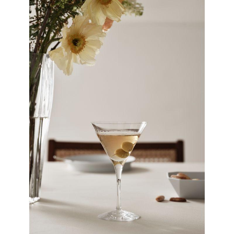 The More Martini glass, holding 6.4 oz, from Orrefors is a classic v-shaped glass that fits all types of cocktails, such as Dry Martinis and Cosmopolitan. Designed by Erika Lagerbielke.
