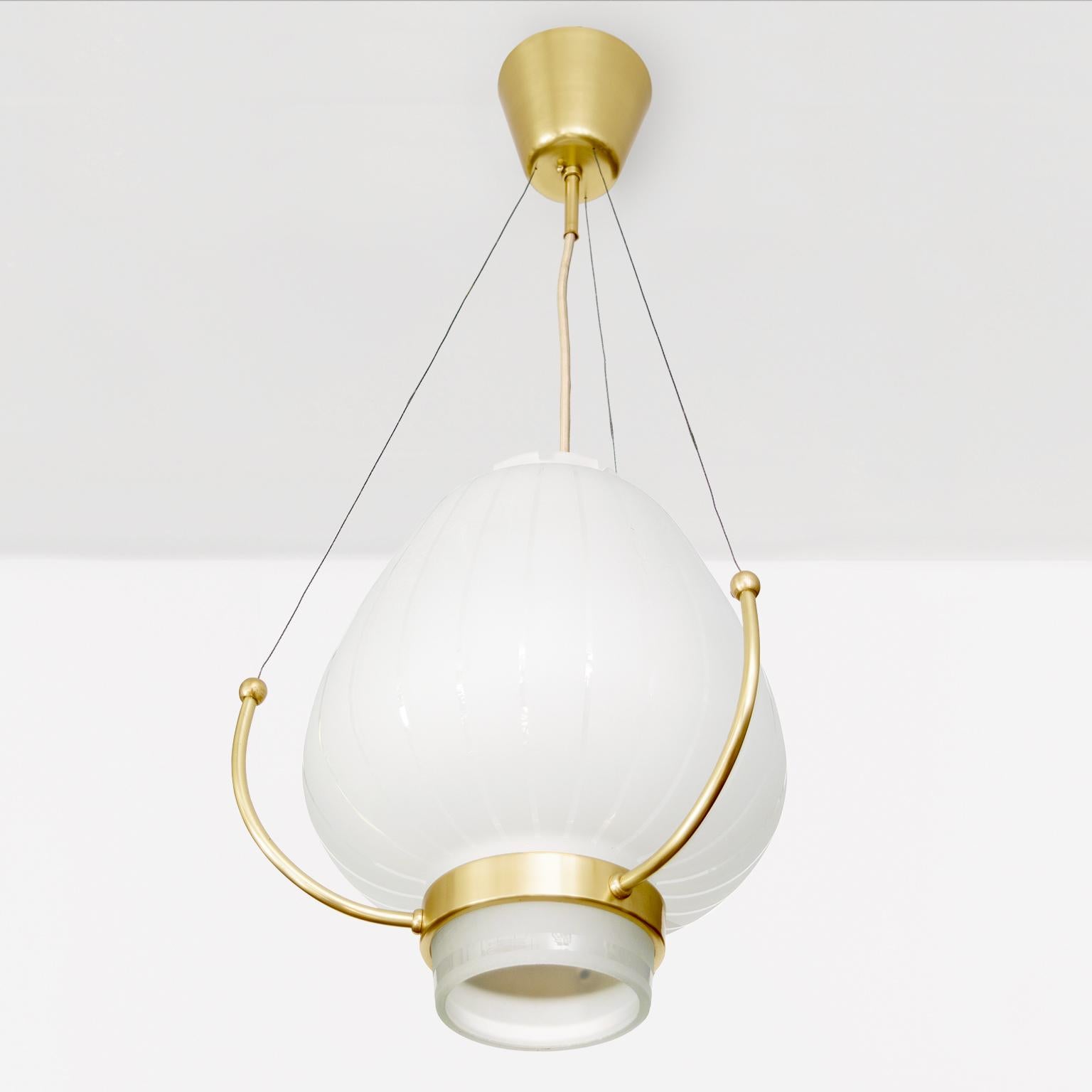 Scandinavian Modern Orrefors Pendant with polished and acid etched shade on a brass frame. For Sale