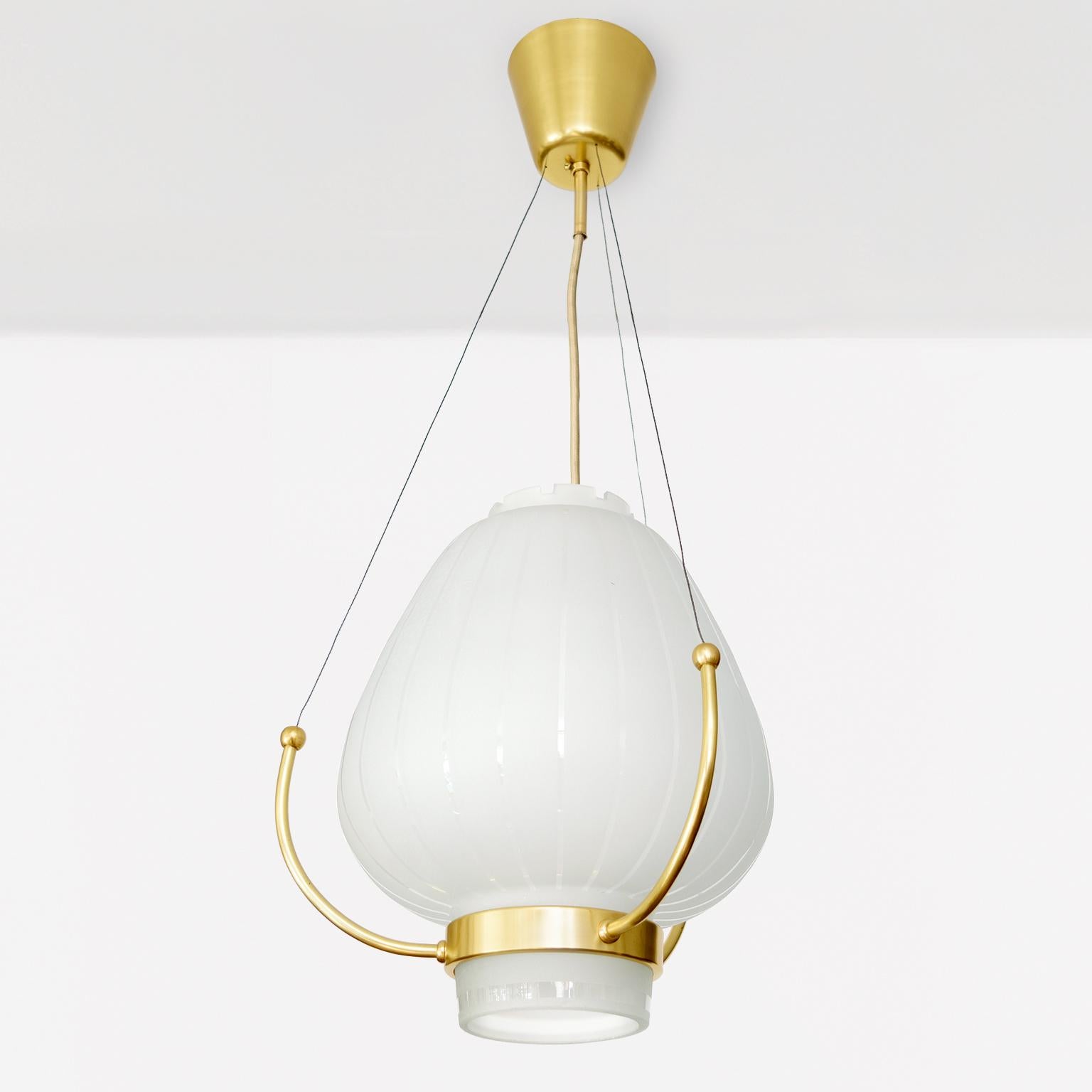 Scandinavian Orrefors Pendant with polished and acid etched shade on a brass frame. For Sale