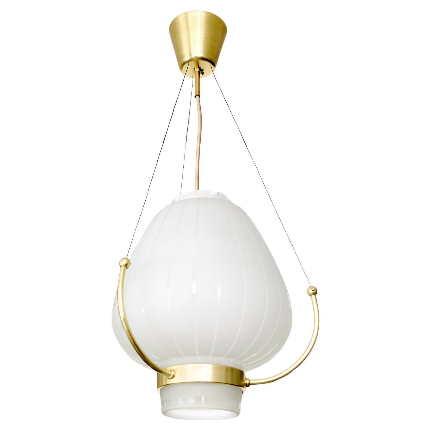 Orrefors Pendant with polished and acid etched shade on a brass frame. For Sale