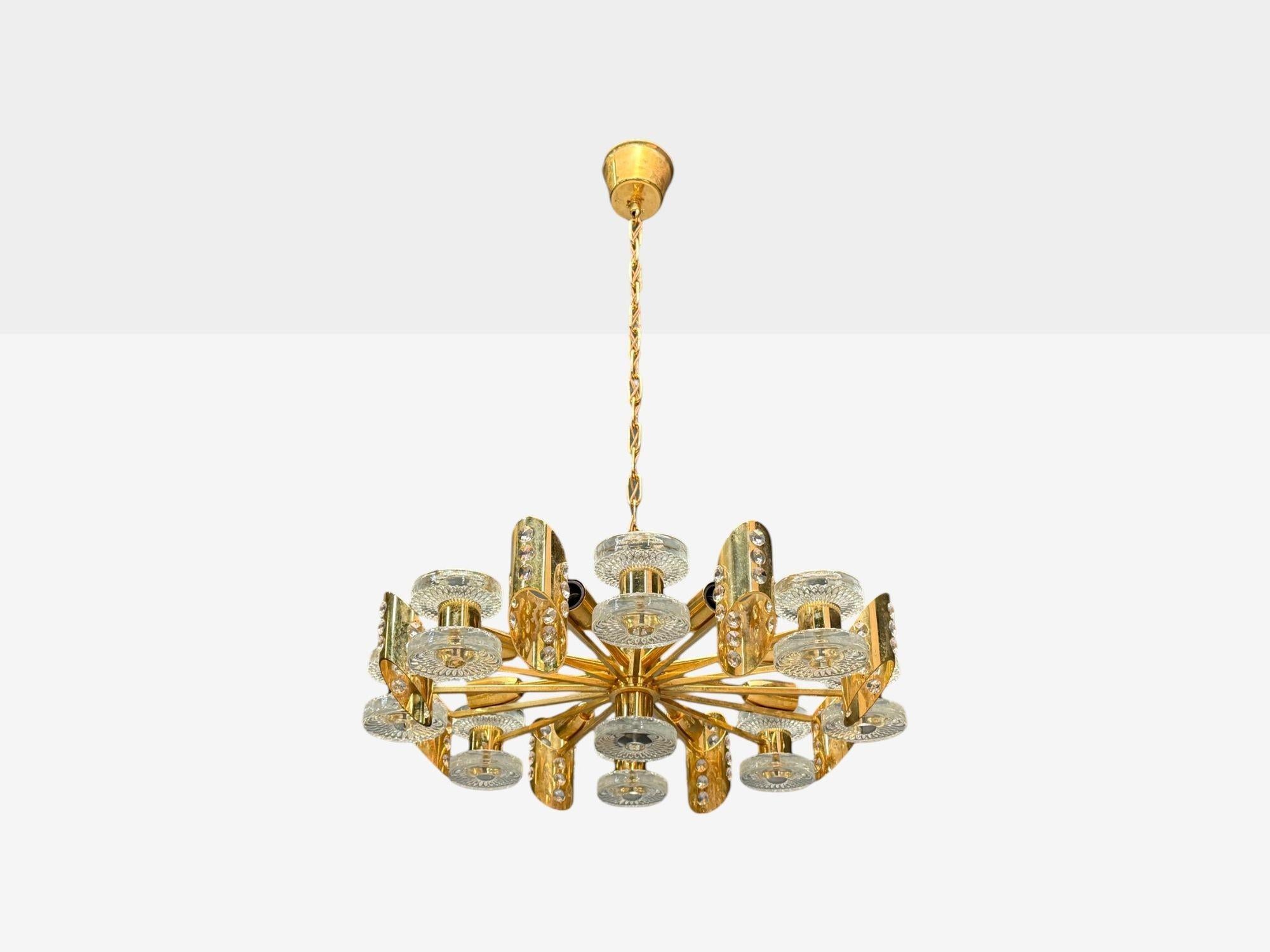 Orrefors, Scandinavian Modern, Brass, Glass, Chandelier, Sweden, 1960s

Swedish modern chandelier in brass, glass and crystal designed and produced by Orrefors in Sweden c. 1960s. This example has eight E14 candelabra light sockets. Re-wiring is
