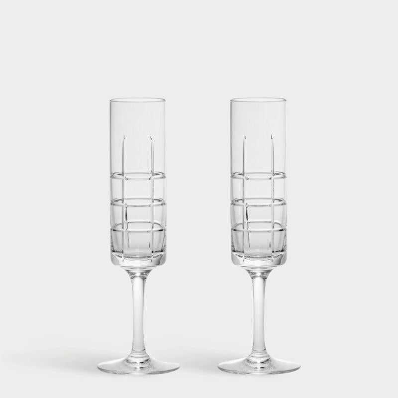 Street Champagne from Orrefors, which holds 5 oz, is well-suited for sparkling beverages, with its long, narrow shape that preserves the bubbles. The flute-shaped glass has a checked motif of straight lines inspired by the criss-cross streets and