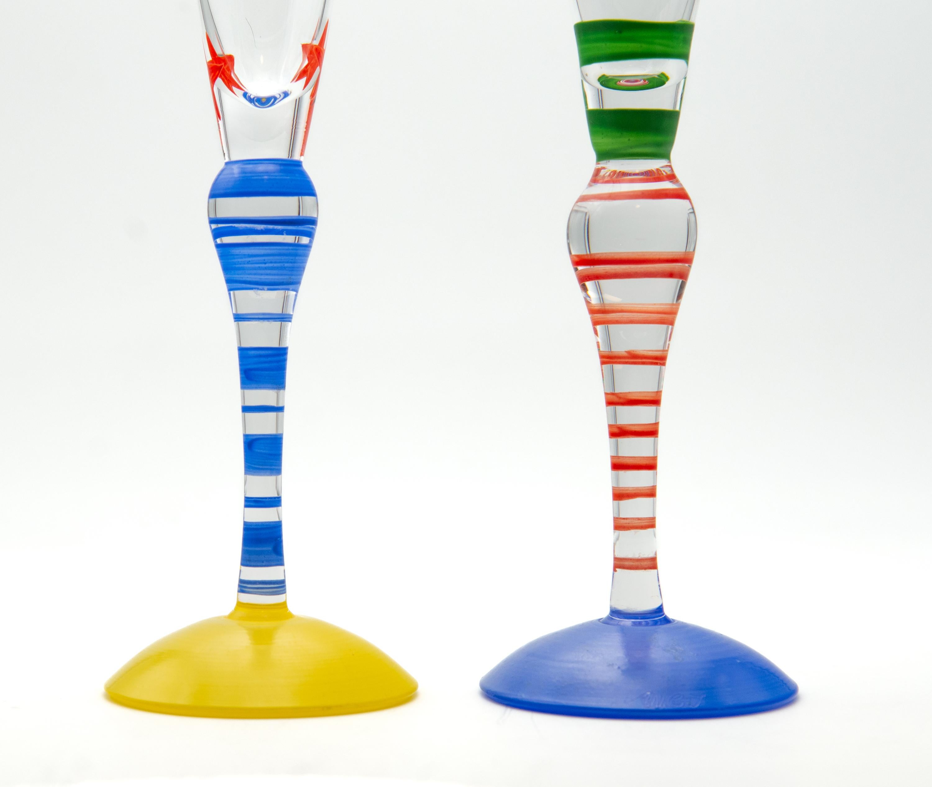 Two Orrefors crystal Clown series champagne flutes designed by Anne Nilsson in 1992 and hand polychrome painted by the artist. Signed.

Delivery included to the mainland UK.

They are in excellent condition, slight smudge on one of the green painted