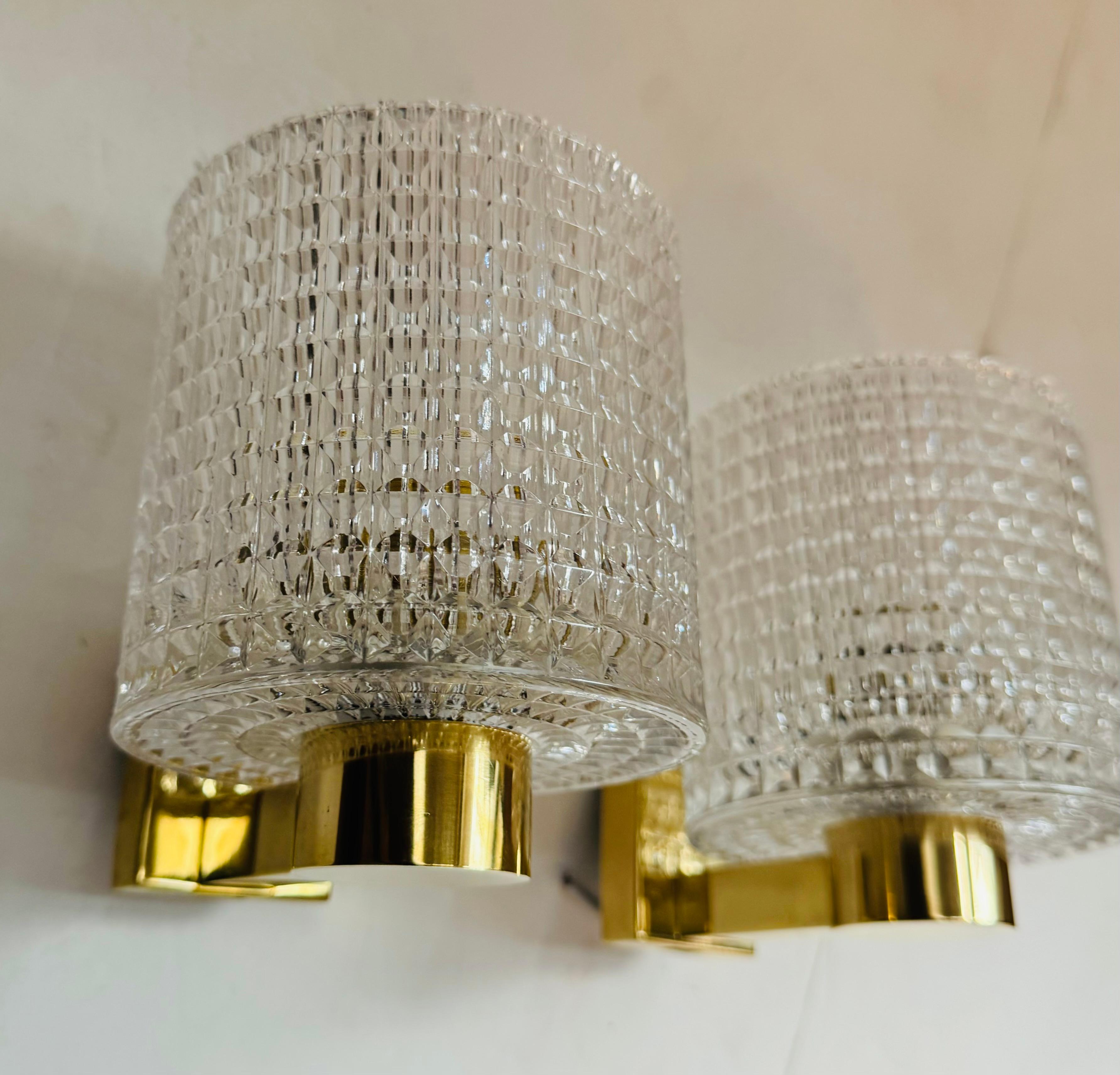 A beautiful luxurious 1950s Swedish crystal and brass flush pendant by Carl Fagerlund for Orrefors. 4 candelabra light sockets . Rewired.