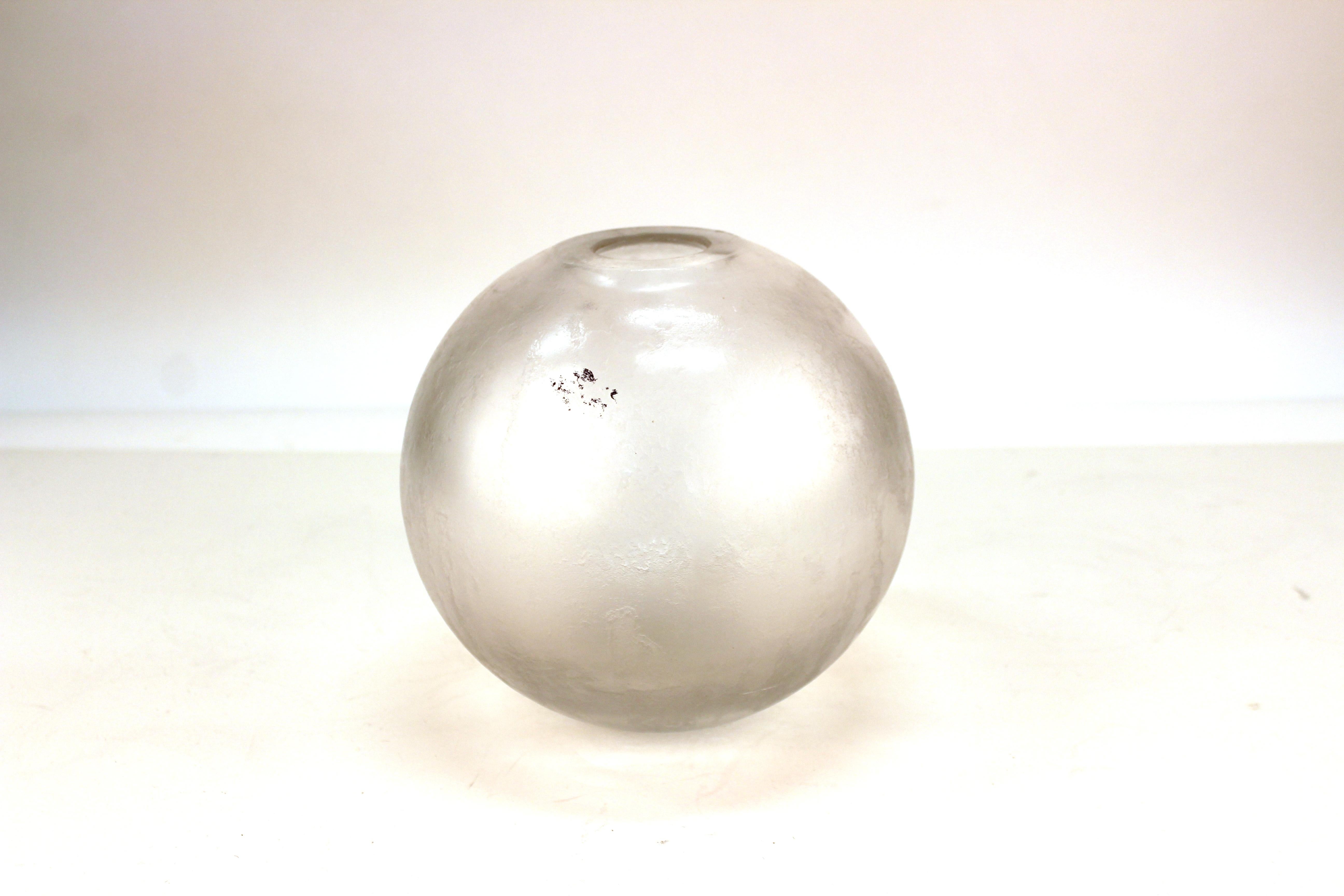 Orrefors Swedish Mid-Century Modern iridescent globular glass vase with textured surface. The piece has an etched makers mark on the bottom and is in great vintage condition.