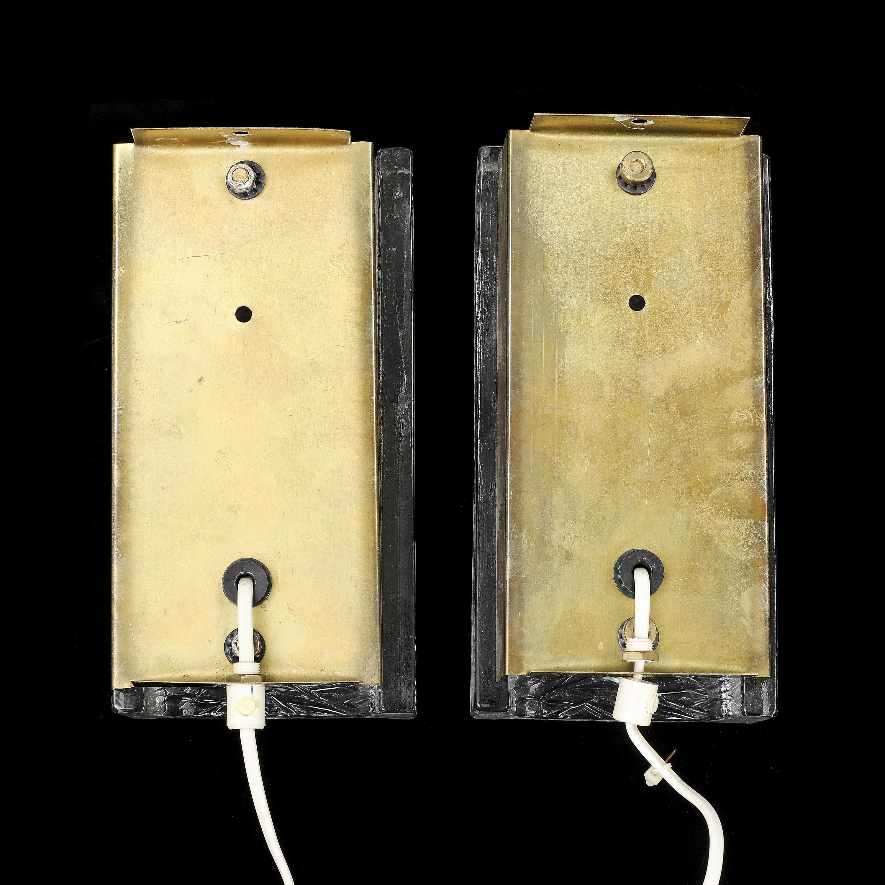 Swedish Orrefors wall light cast glass and brass a pair Sweden 1960 For Sale